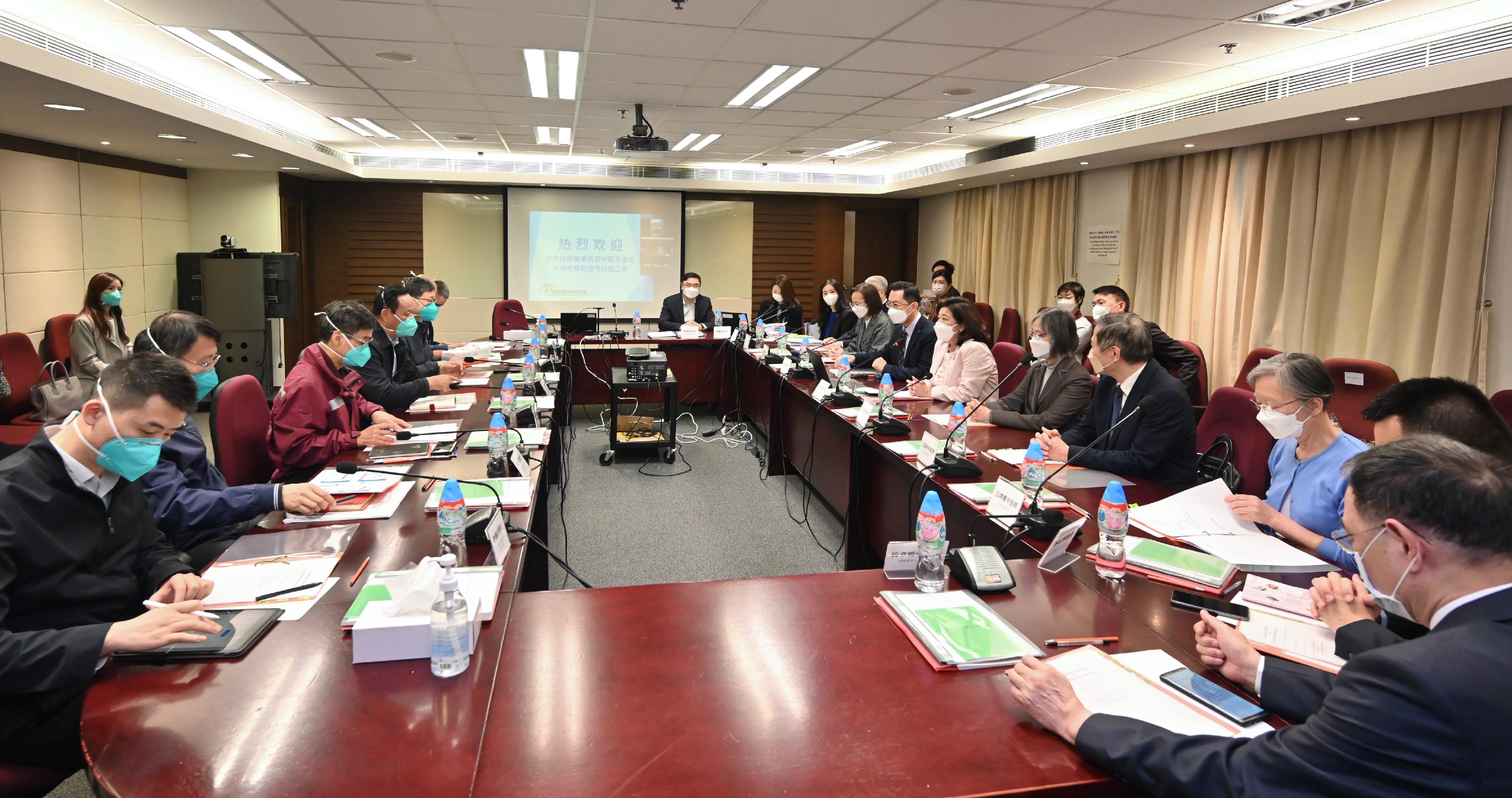 The Director of Health, Dr Ronald Lam (seventh right), together with the Chairman of the Chinese Medicine Council of Hong Kong, Mrs Jeanie Hu Leung Tze-Wai (sixth right) and the Chairman of the Chinese Medicine Practitioners Board, Dr Wong Yu-yeuk (fifth right), hold a meeting with the Leader of the Mainland Chinese medicine expert group of the Central Authorities, Mr Tong Xiaolin (fourth left) and other group members this morning (March 30) to exchange views on the current regulation and development of Chinese medicine in Hong Kong, with in-depth discussion on measures in fighting against the epidemic with Chinese medicine.