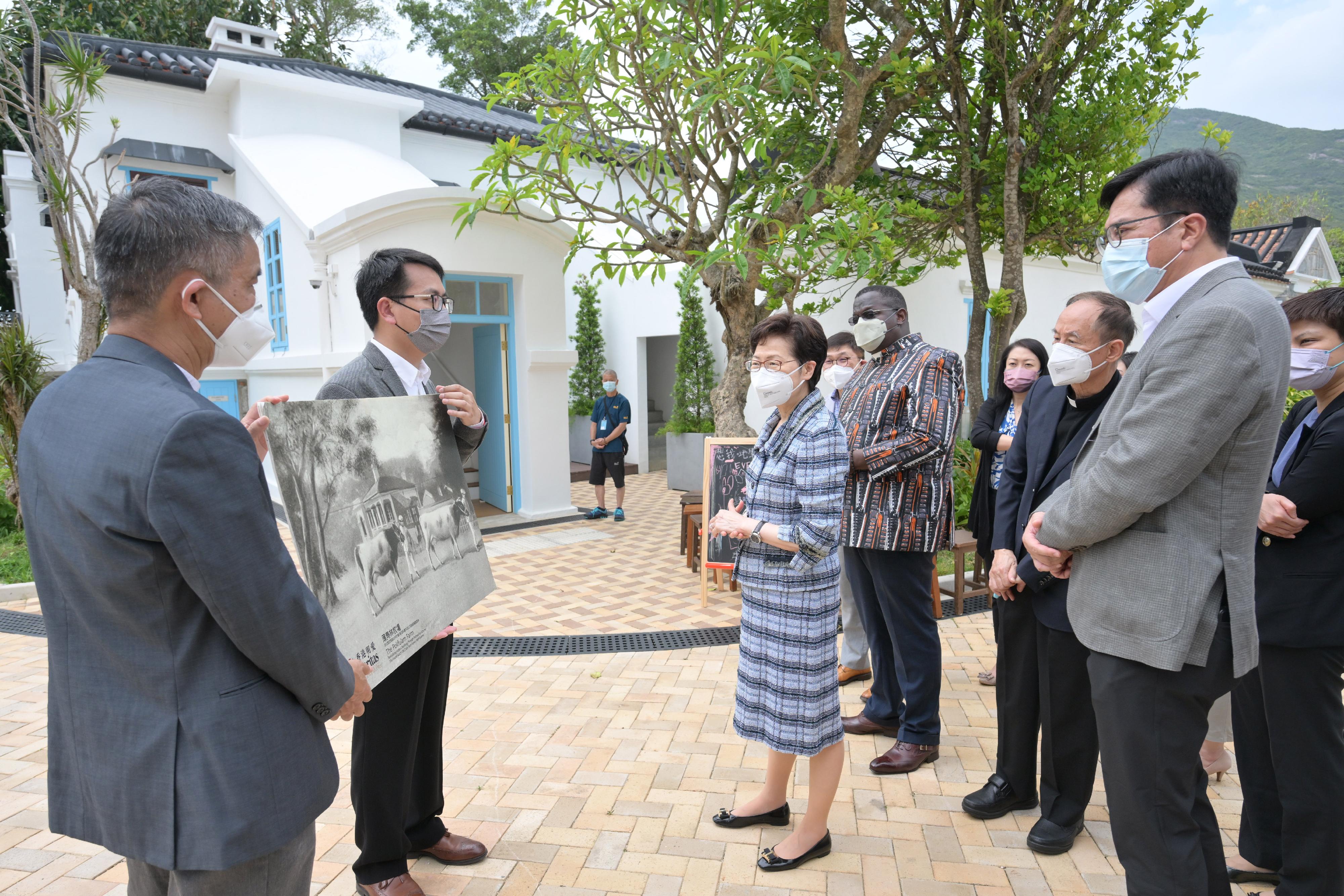 The Chief Executive, Mrs Carrie Lam (third left), today (April 22) visited The Pokfulam Farm to learn more about the revitalisation of the Old Dairy Farm Senior Staff Quarters in Pok Fu Lam under Batch IV of the Revitalising Historic Buildings Through Partnership Scheme. Looking on are the Secretary for Development, Mr Michael Wong (second right), and the Chief Executive of Caritas-Hong Kong, the Reverend Joseph T L Yim (third right).

