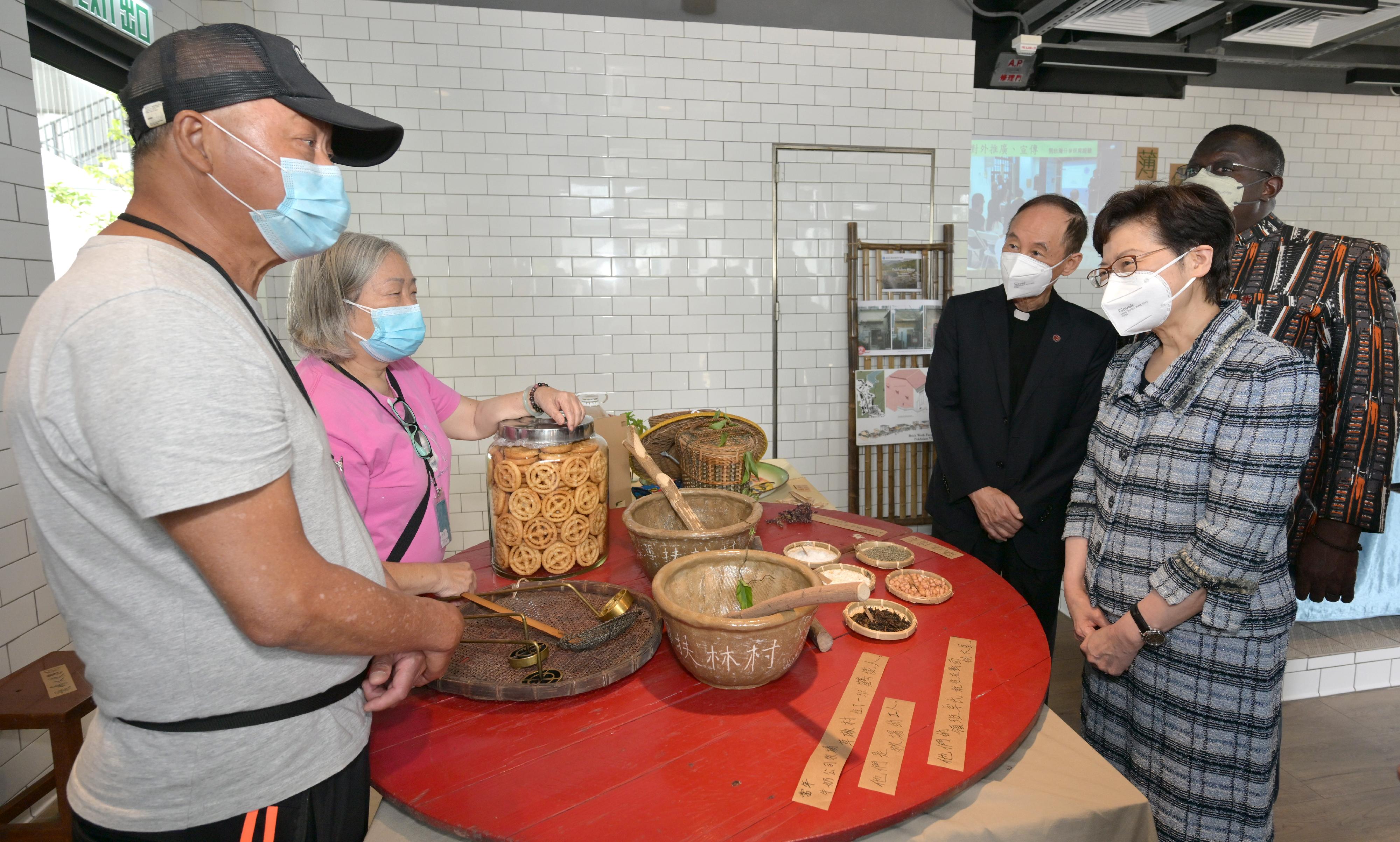 The Chief Executive, Mrs Carrie Lam (second right), today (April 22) visited The Pokfulam Farm to learn more about the revitalisation of the Old Dairy Farm Senior Staff Quarters in Pok Fu Lam under Batch IV of the Revitalising Historic Buildings Through Partnership Scheme. Looking on is the Chief Executive of Caritas-Hong Kong, the Reverend Joseph T L Yim (third right).