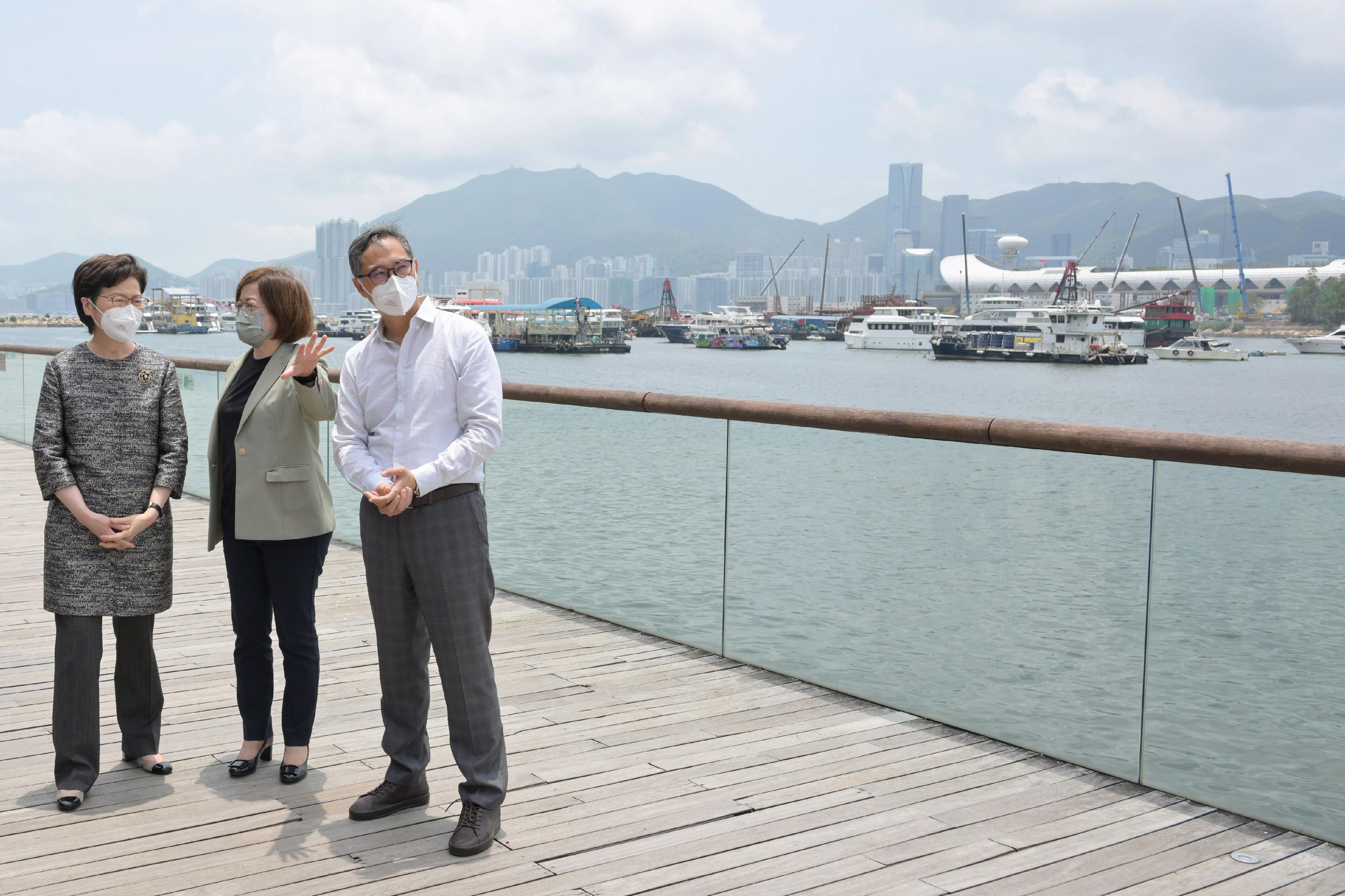 The Chief Executive, Mrs Carrie Lam, today (April 29) visited the Energizing Kowloon East Office (EKEO) and toured the area to survey the latest developments of the Energizing Kowloon East initiative. Photo shows Mrs Lam (left) touring the Kwun Tong Promenade. Also present are the Permanent Secretary for Development (Works), Mr Ricky Lau (right), and the Head of the EKEO, Ms Amy Cheung (centre).