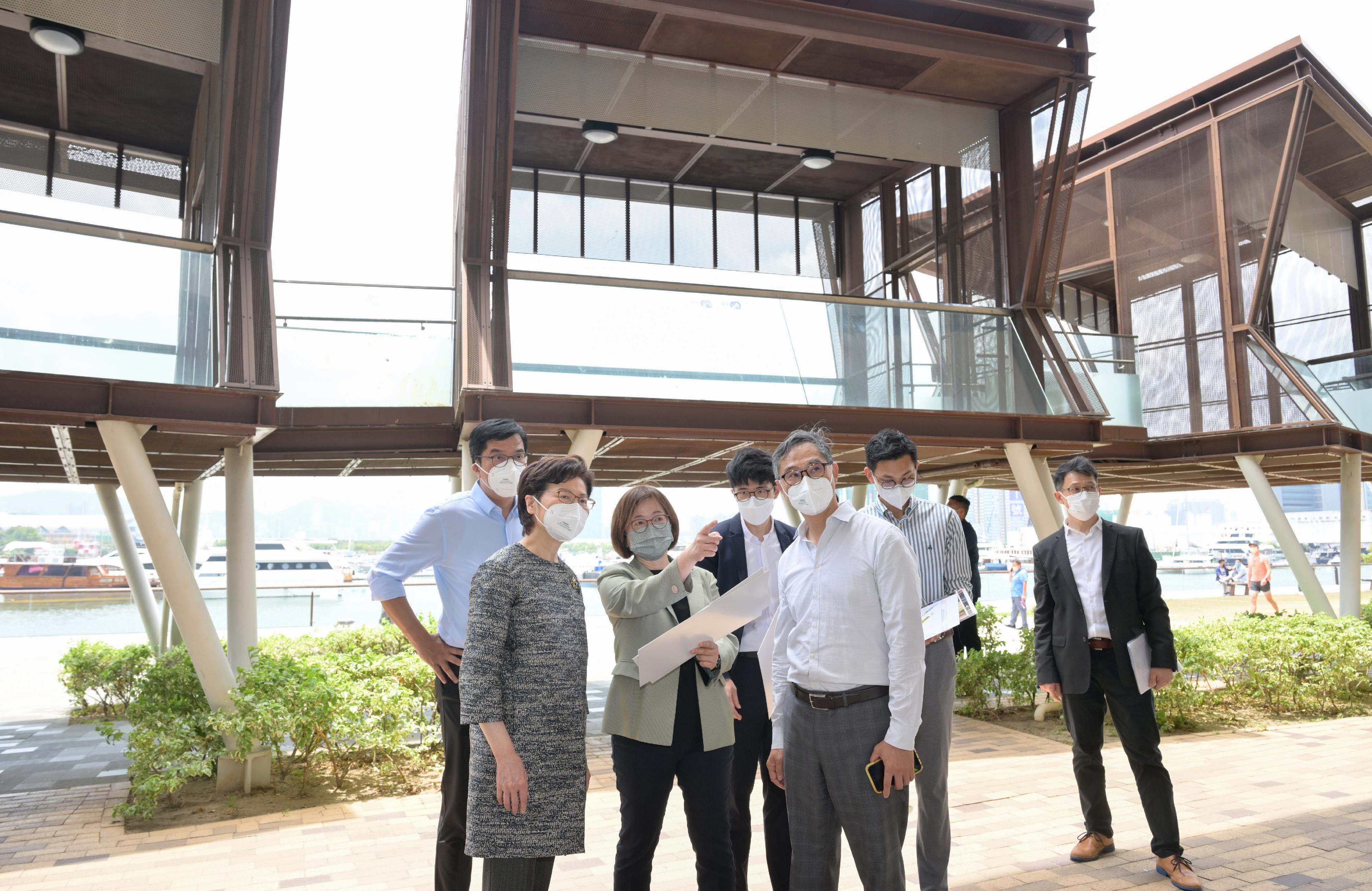 The Chief Executive, Mrs Carrie Lam, today (April 29) visited the Energizing Kowloon East Office (EKEO) and toured the area to survey the latest developments of the Energizing Kowloon East initiative. Photo shows Mrs Lam (second left), accompanied by the Secretary for Development, Mr Michael Wong (first left), and the Permanent Secretary for Development (Works), Mr Ricky Lau (third right), receiving a briefing on the latest development of the Kwun Tong Promenade by the Head of the EKEO, Ms Amy Cheung (third left).
