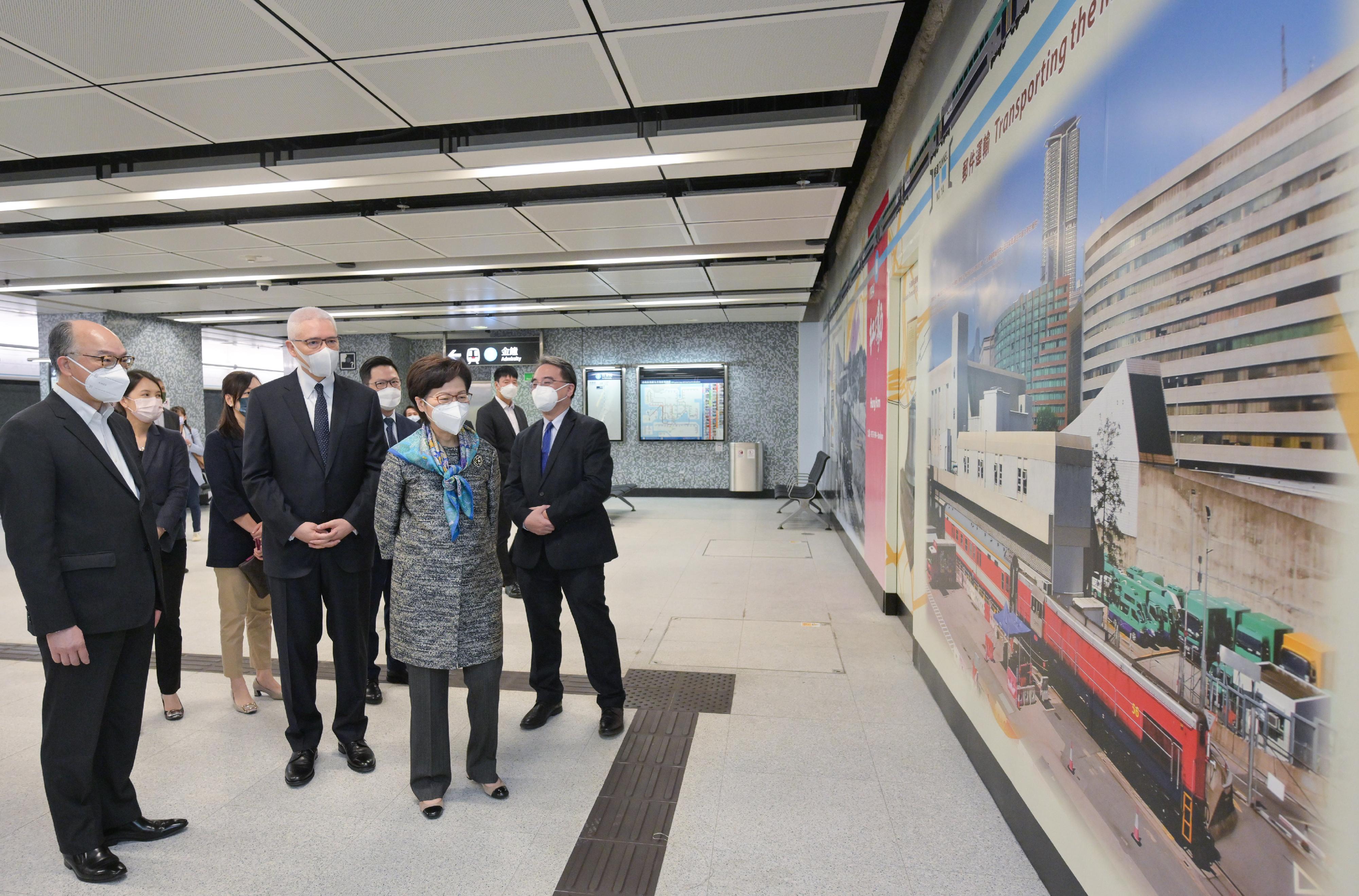 The Chief Executive, Mrs Carrie Lam, visited Wan Chai North today (May 4) to view the newly constructed Exhibition Centre Station of the East Rail Line cross-harbour extension and the neighbouring facilities. Photo shows Mrs Lam (front row, second right) visiting the station's platform. Looking on are the Secretary for Transport and Housing, Mr Frank Chan Fan (front row, first left); the Chairman of the MTR Corporation Limited (MTRCL), Dr Rex Auyeung (front row, second left); and the Chief Executive Officer of the MTRCL, Dr Jacob Kam (front row, first right).