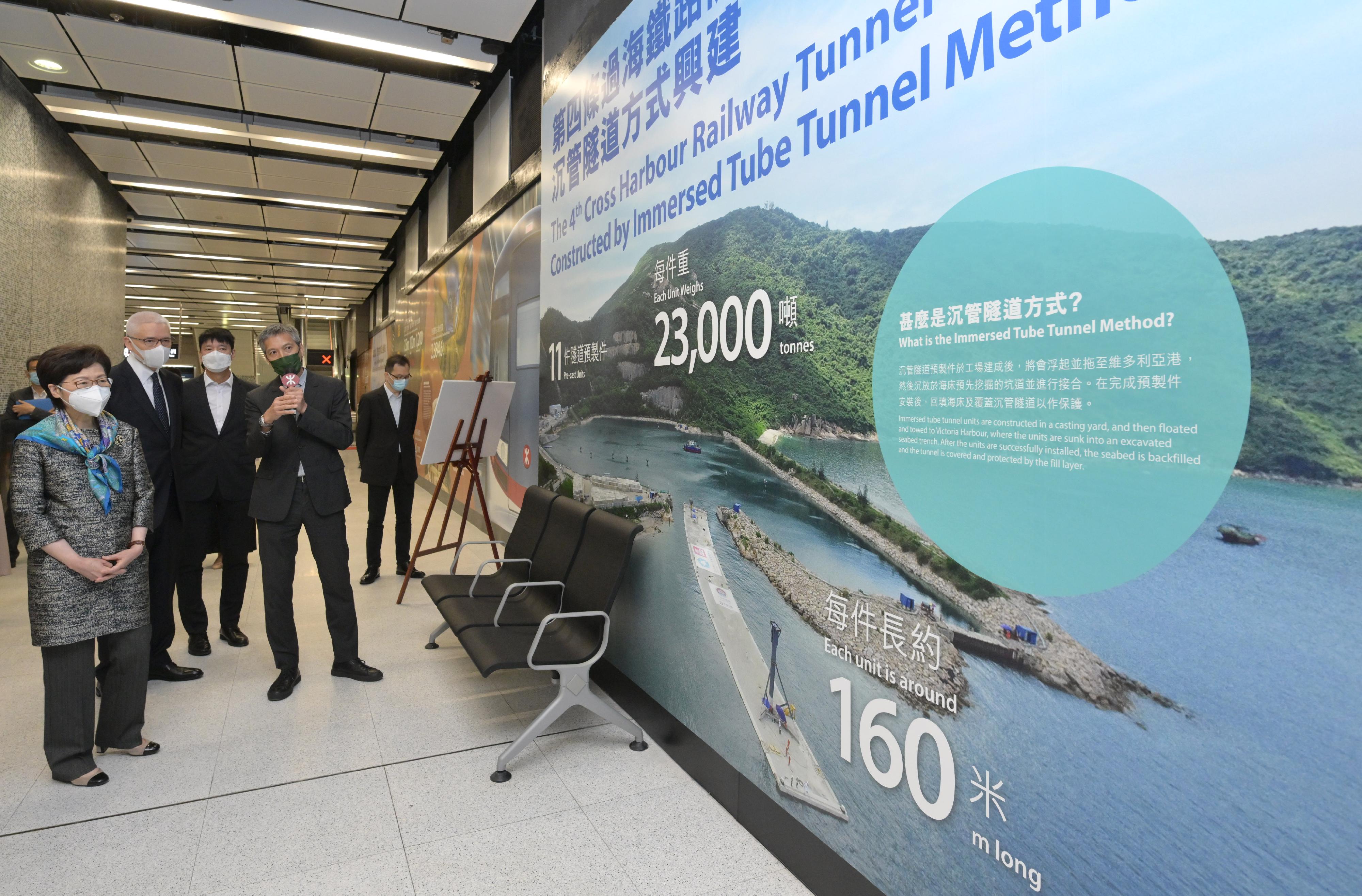 The Chief Executive, Mrs Carrie Lam, visited Wan Chai North today (May 4) to view the newly constructed Exhibition Centre Station of the East Rail Line cross-harbour extension and the neighbouring facilities. Photo shows Mrs Lam (first left) visiting the station's platform. Looking on are the Director of Highways, Mr Jimmy Chan (third left), and the Chairman of the MTR Corporation Limited, Dr Rex Auyeung (second left).