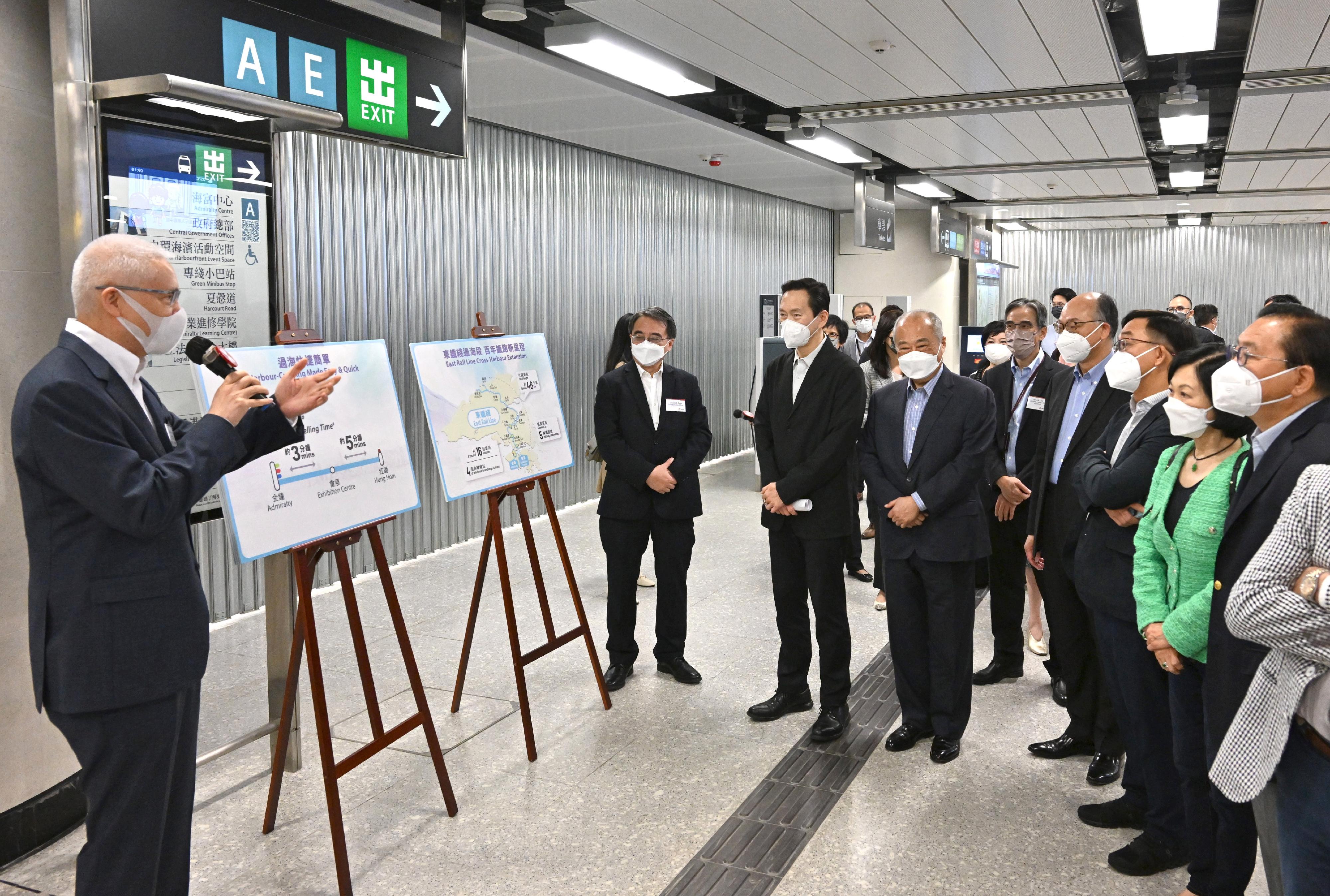Non-official Members of the Executive Council (ExCo Non-official Members) today (May 5) visited the stations of the East Rail Line cross-harbour extension. Photo shows the ExCo Non-official Members, accompanied by the Secretary for Transport and Housing, Mr Frank Chan Fan (fourth right), being briefed by the Chairman of the MTR Corporation Limited, Dr Rex Auyeung (first left), on the East Rail Line cross-harbour extension project at the extension part of Admiralty Station.
