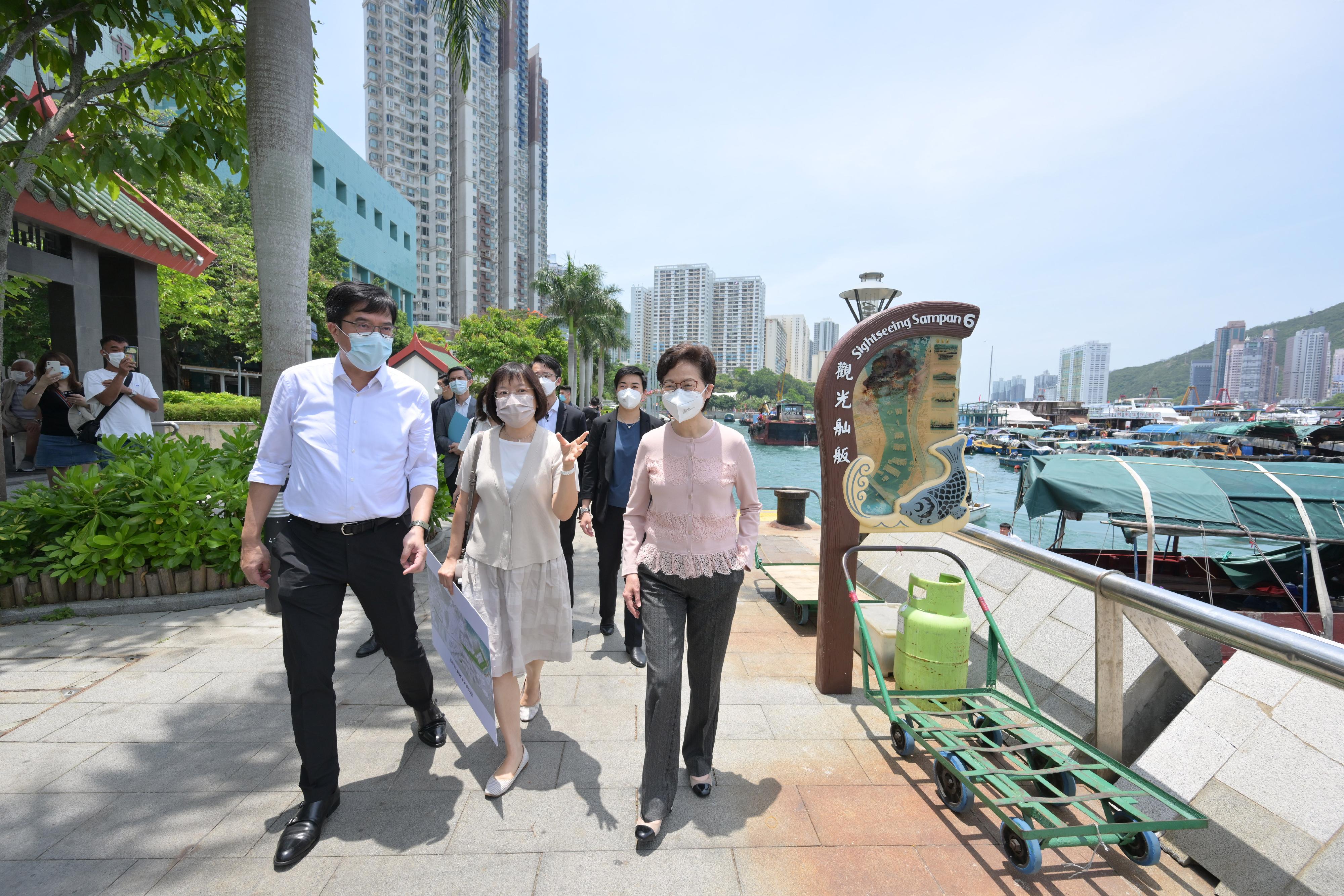 The Chief Executive, Mrs Carrie Lam, today (May 5) visited Wong Chuk Hang and Ap Lei Chau in Southern District to learn about the progress of the Invigorating Island South initiative. Photo shows Mrs Lam (front, right) touring the Ap Lei Chau Waterfront Promenade. Also present are the Secretary for Development, Mr Michael Wong (front, left), and the Head of the Invigorating Island South Office, Ms Brenda Au (front, centre).