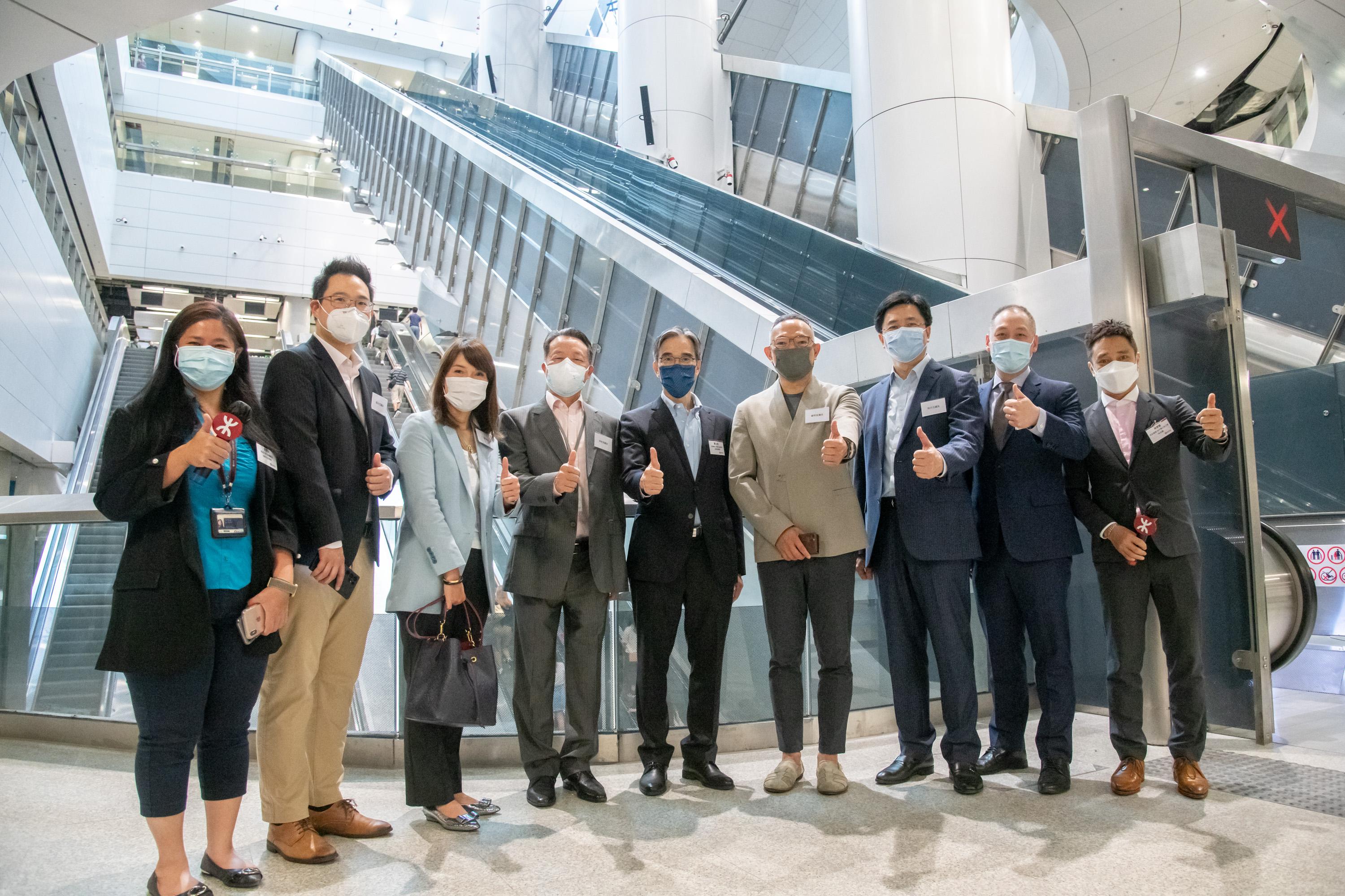 The Legislative Council (LegCo) Panel on Transport visits Admiralty and Exhibition Centre Stations of the East Rail Line cross-harbour extension today (May 6). Photo shows LegCo members visiting the concourse area of the Admiralty Station extension.