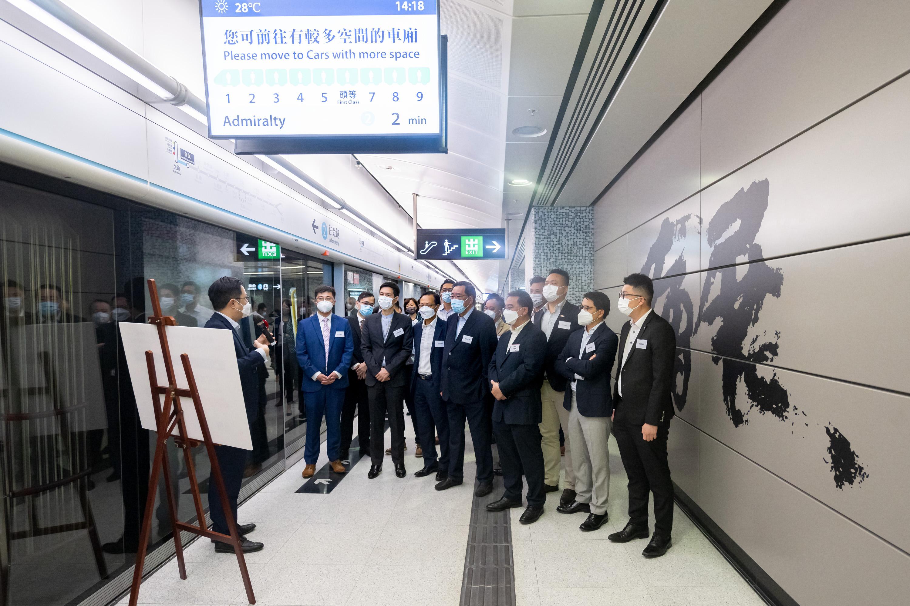 The Legislative Council (LegCo) Panel on Transport visits Admiralty and Exhibition Centre Stations of the East Rail Line cross-harbour extension today (May 6). Photo shows LegCo members touring the platform of the newly-built Exhibition Centre Station.