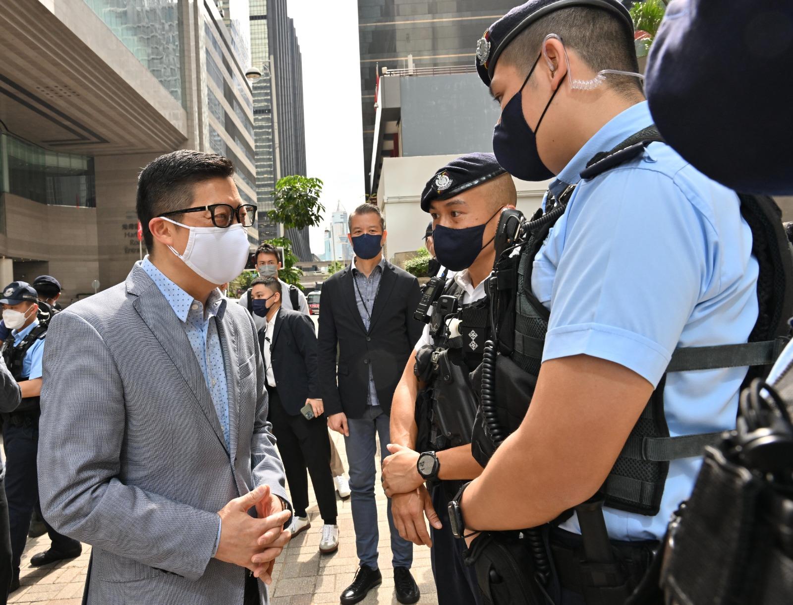 The Secretary for Security, Mr Tang Ping-keung, this morning (May 8) inspected the security arrangements in the vicinity of the Hong Kong Convention and Exhibition Centre (HKCEC) to ensure the 2022 Chief Executive Election be conducted in a safe and orderly manner. Photo shows Mr Tang (second left), accompanied by the Hong Kong Police Force's Regional Commander (Hong Kong Island), Mr Kwok Pak-chung (third right), touring outside the HKCEC and the nearby area and learning about Police’s deployment, security and traffic arrangements on the polling day.