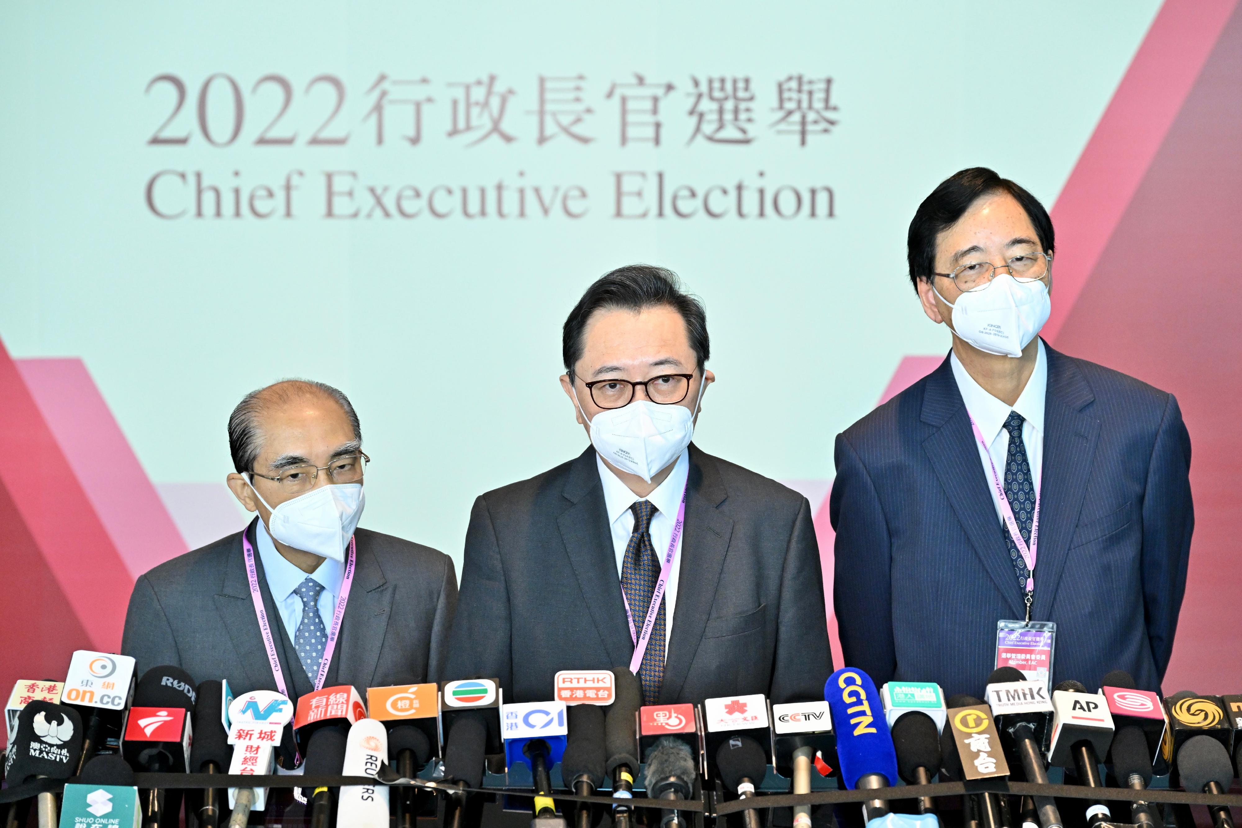 The Chairman of the Electoral Affairs Commission (EAC), Mr Justice Barnabas Fung Wah (centre); EAC members Mr Arthur Luk, SC (left), and Professor Daniel Shek (right), meet the media this morning (May 8) after visiting the main polling station of the 2022 Chief Executive Election at the Hong Kong Convention and Exhibition Centre in Wan Chai.