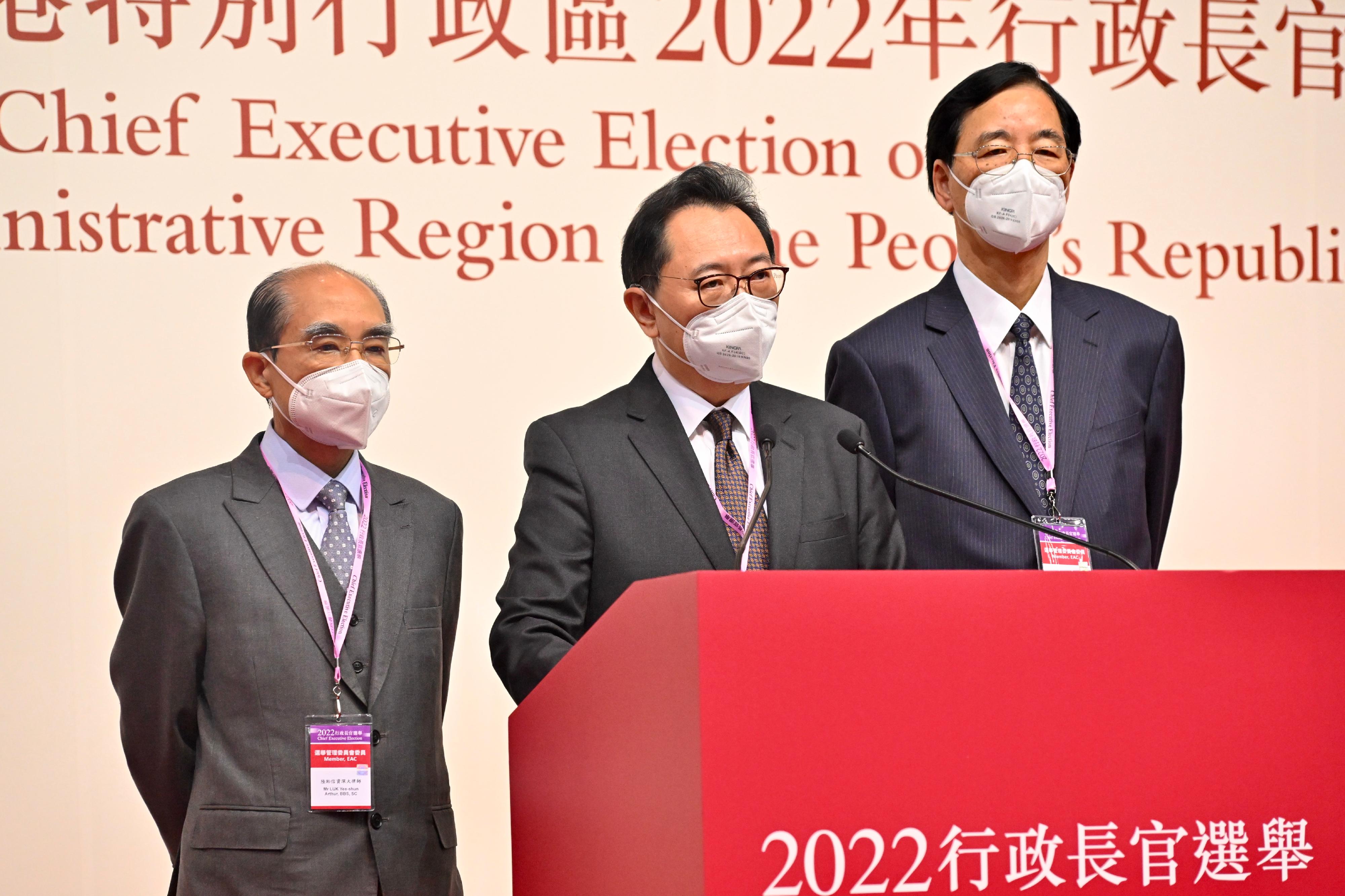 The Chairman of the Electoral Affairs Commission (EAC), Mr Justice Barnabas Fung Wah (centre); EAC members Mr Arthur Luk, SC (left), and Professor Daniel Shek (right) meet the media to conclude the election this afternoon (May 8) at the central counting station cum media centre of the 2022 Chief Executive Election at the Hong Kong Convention and Exhibition Centre in Wan Chai.