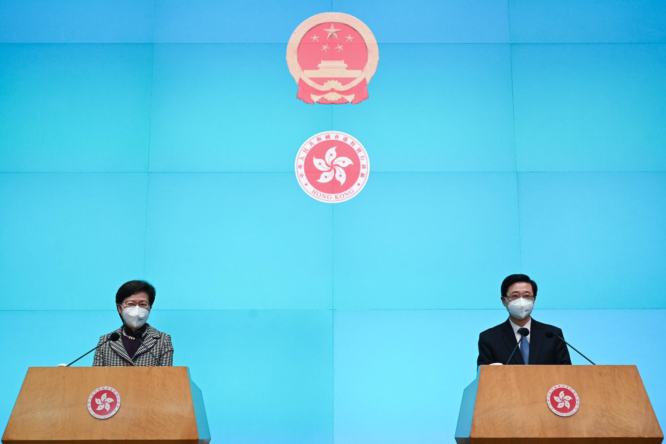 The Chief Executive, Mrs Carrie Lam (left), and the sixth-term Chief Executive-elect, Mr John Lee (right), meet the media after their meeting at the Chief Executive's Office this morning (May 9).