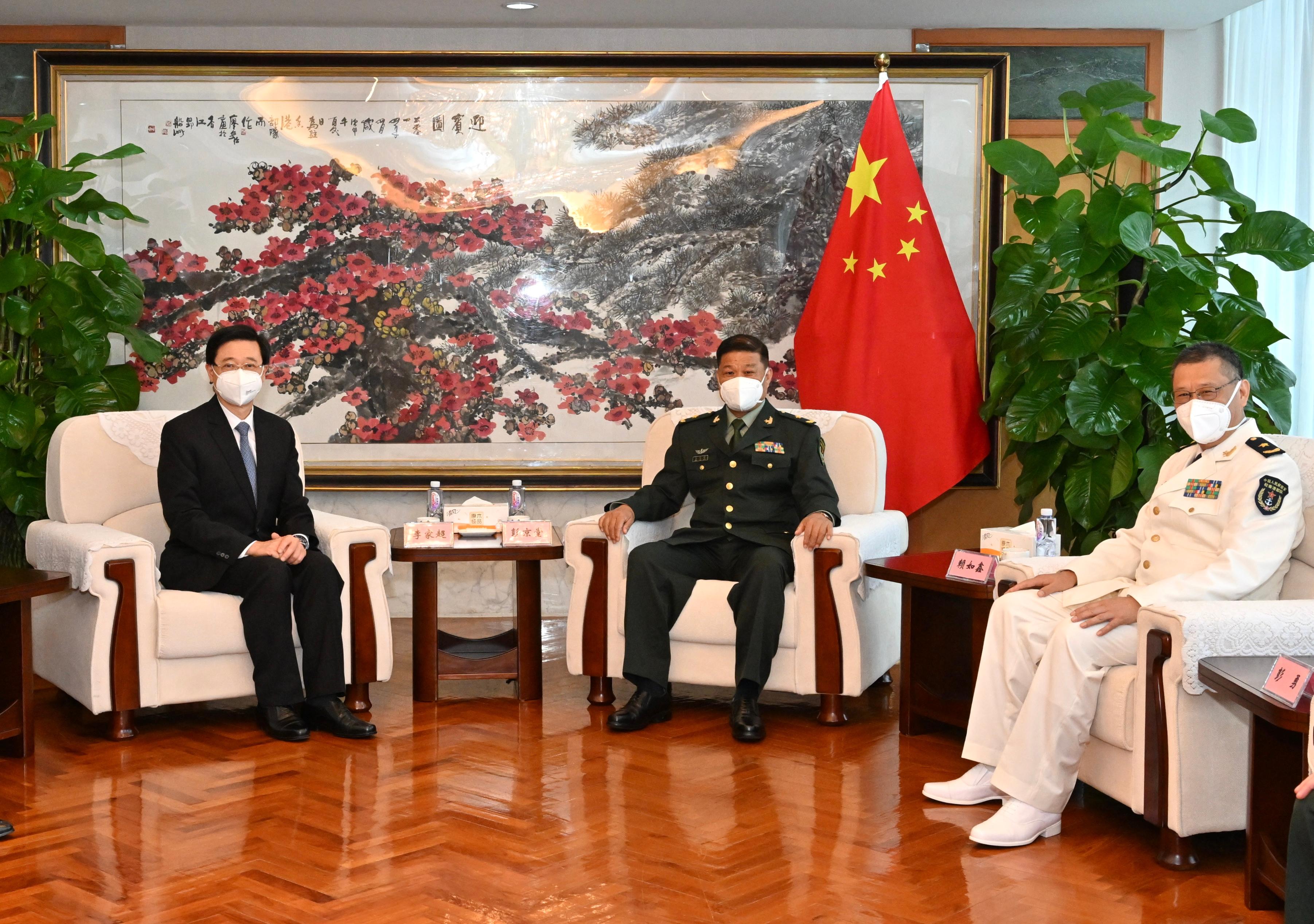 The Chief Executive-elect, Mr John Lee (left), pays a courtesy call on the Commander-in-chief of the Chinese People's Liberation Army (PLA) Hong Kong Garrison, Major General Peng Jingtang (centre) and the Political Commissar of the PLA Hong Kong Garrison, Navy Rear Admiral Lai Ruxin (right), this afternoon (May 9).