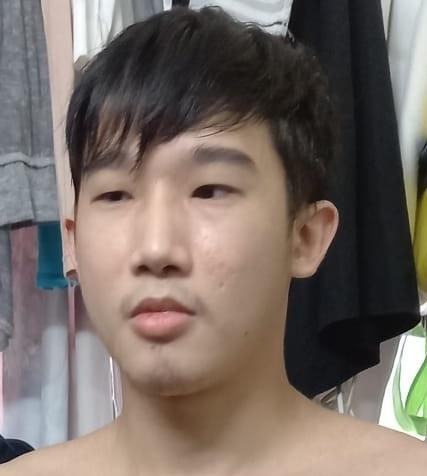 Huang Zhijie, aged 24, is about 1.7 metres tall, 55 kilograms in weight and of thin build. He has a pointed face with yellow complexion and short black hair. He was last seen wearing a black short-sleeved T-shirt, black long trousers and black and white shoes.