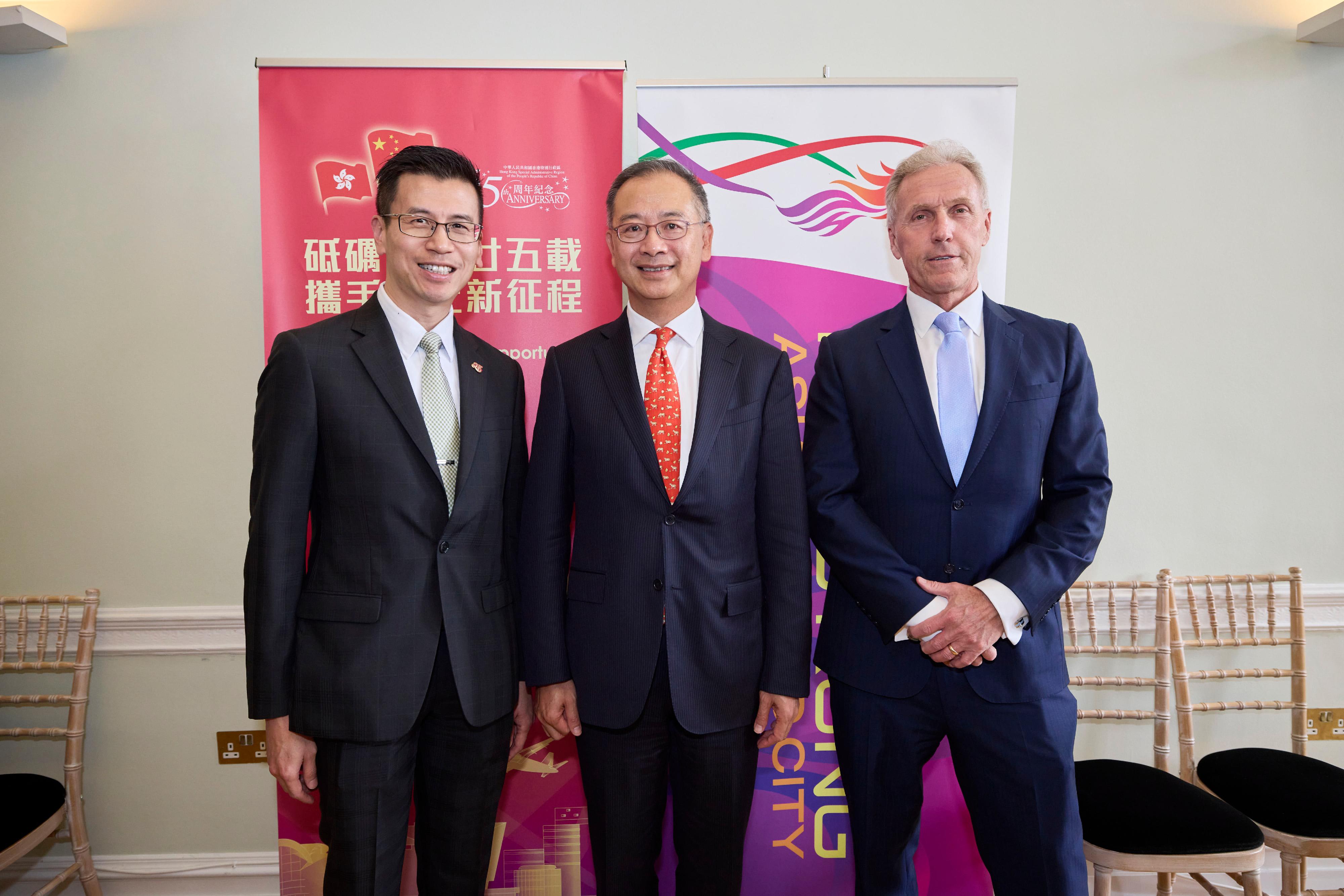 The Hong Kong Economic and Trade Office, London (London ETO), partnered with the Asia House on 12 May (London time) to hold a seminar for leaders in UK’s financial services sector.  Photo shows the Director-General of the London ETO, Mr Gilford Law (left), the Chief Executive of the Hong Kong Monetary Authority, Mr Eddie Yue (centre), and the Chief Executive of the Asia House, Mr Michael Lawrence (right), at the seminar.