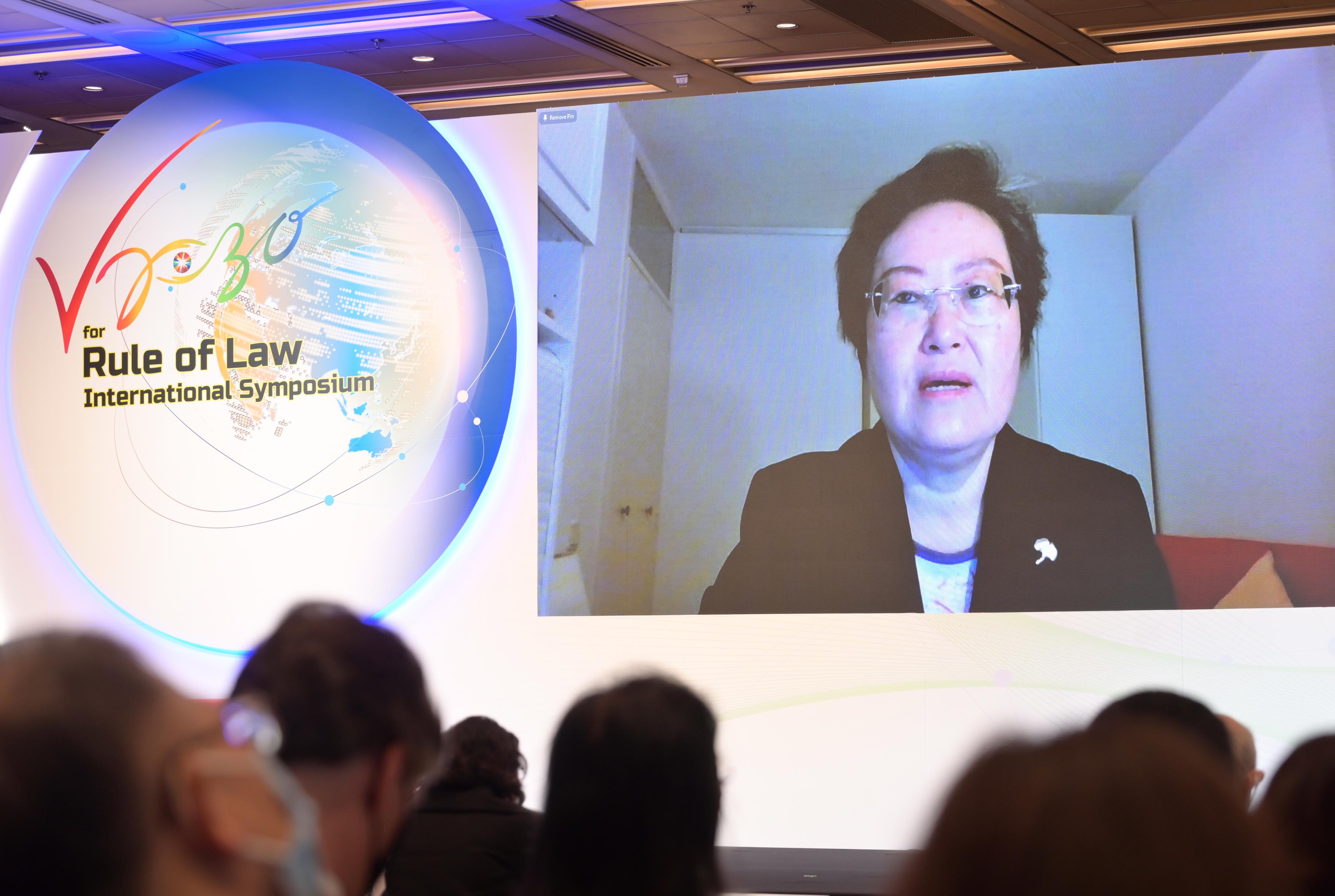 The Vision 2030 for Rule of Law International Symposium, co-organised by the Department of Justice, the Asian Peace and Reconciliation Council and the Asian Academy of International Law, was held today (May 26) in a hybrid format. Photo shows Judge Xue Hanqin of the International Court of Justice delivering a keynote speech at the forum.