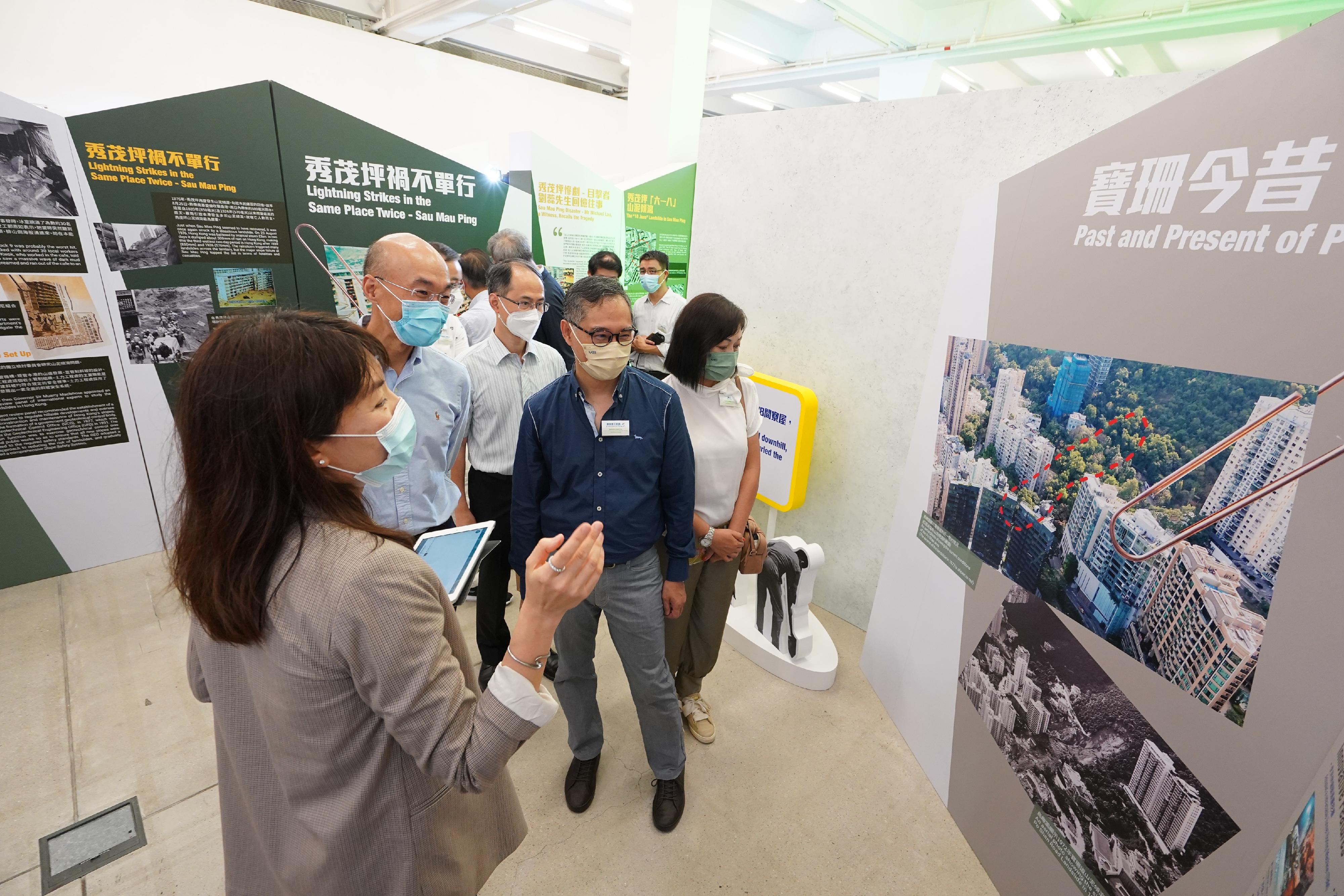 The Geotechnical Engineering Office of the Civil Engineering and Development Department holds a thematic exhibition on the commemorative campaign Remembrance and Reflection: 50 years after the Tragic Landslides on 18 June 1972 at Tai Kwun from today (June 3) until June 6. Photo shows the Permanent Secretary for Development (Works), Mr Ricky Lau (fourth left), and the Director of Civil Engineering and Development, Mr Michael Fong (second left), touring the exhibition.