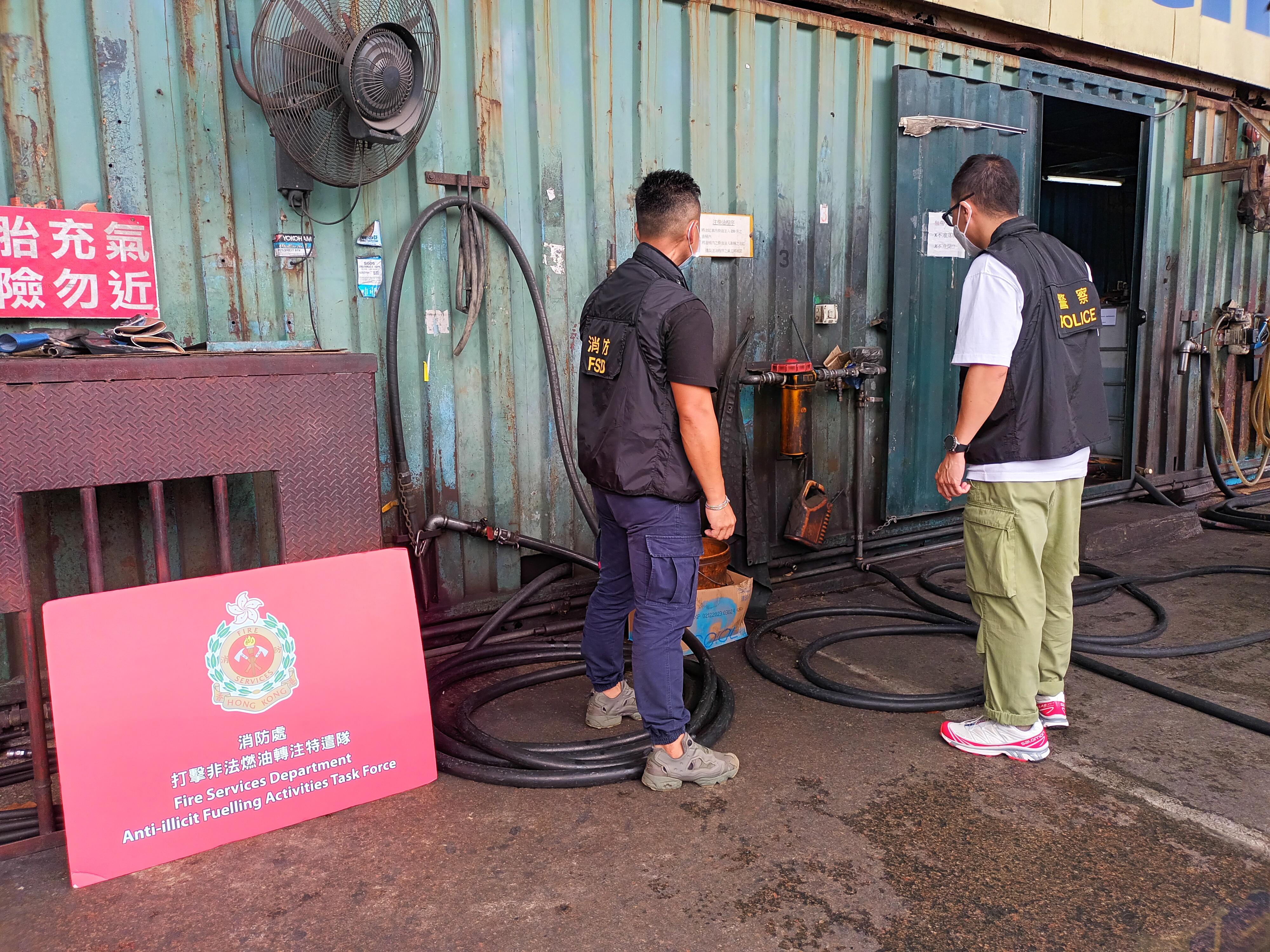 The Fire Services Department, the Hong Kong Police Force and Hong Kong Customs mounted a territory-wide joint operation codenamed "Crescent" from June 7 to 9 to combat illicit fuelling activities. Photo shows law enforcement officers inspecting fuelling facilities at a suspected illegal fuelling station during the joint operation.