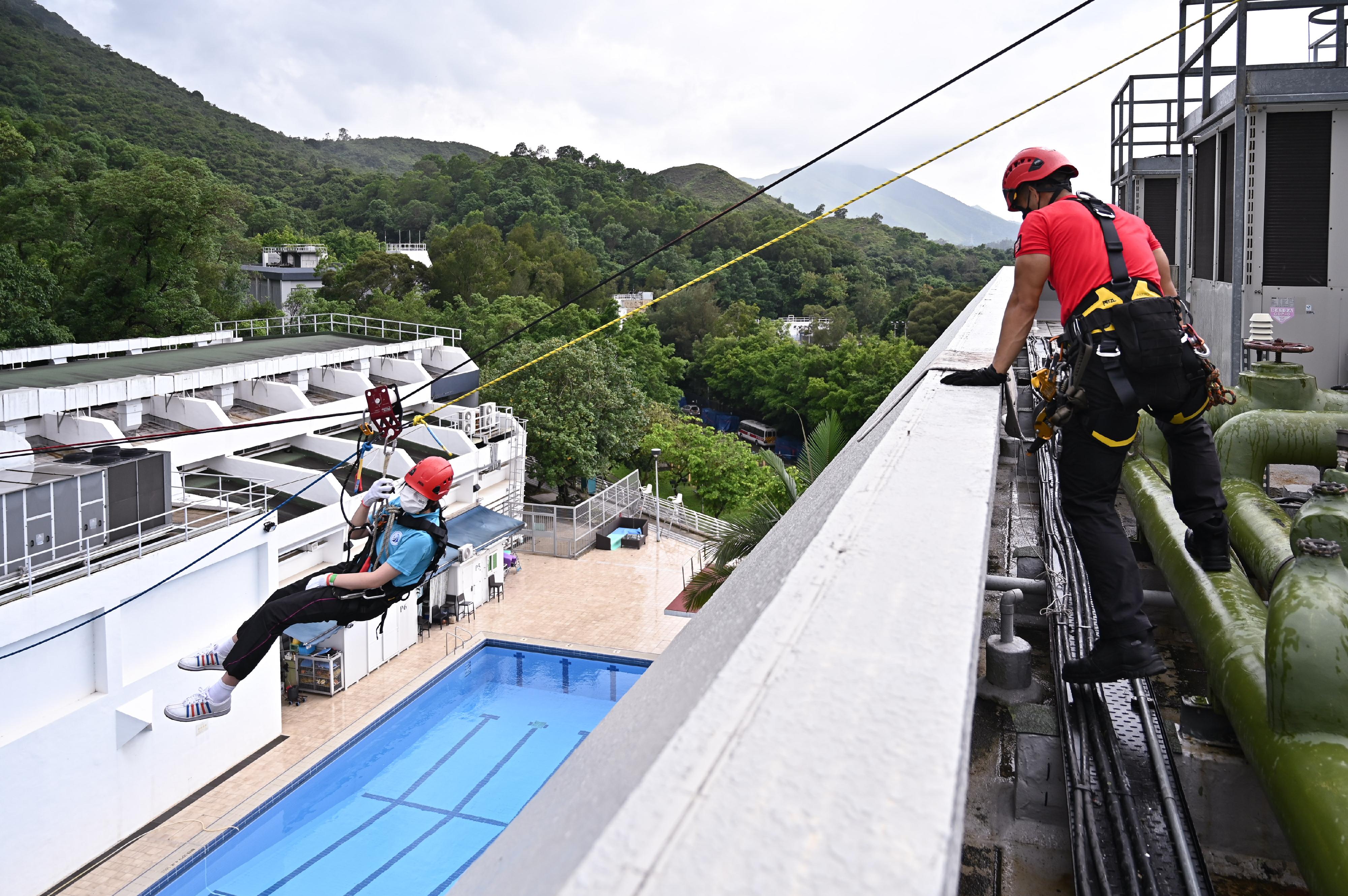 The Hong Kong Police Force today (June 11) launched a one-year anti-drug youth leadership development programme, "Leadership Institute on Narcotics". Photo shows the participants taking part in zip line activity during the training session this morning.