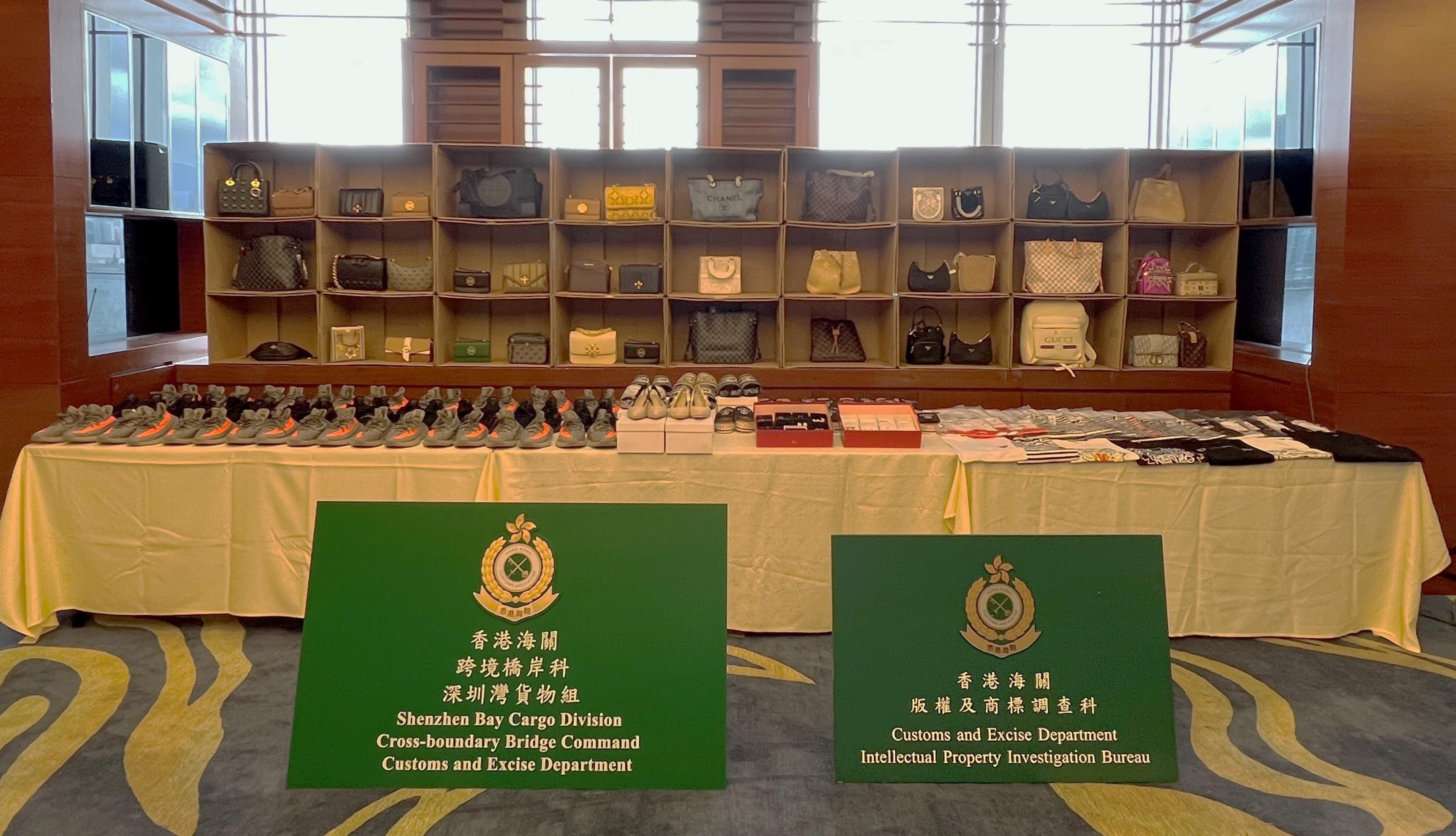Hong Kong Customs conducted a series of operations between May 17 and June 9 to combat cross-boundary transshipment and local sale of counterfeit goods and detected 11 cases in total. About 10 000 items of suspected counterfeit goods, including footwear, mobile phones, clothing, watches, handbags and fashion accessories, and about 9 300 suspected alternative smoking products, with an estimated market value of over $11.6 million, were seized. Photo shows some of the suspected counterfeit goods seized.