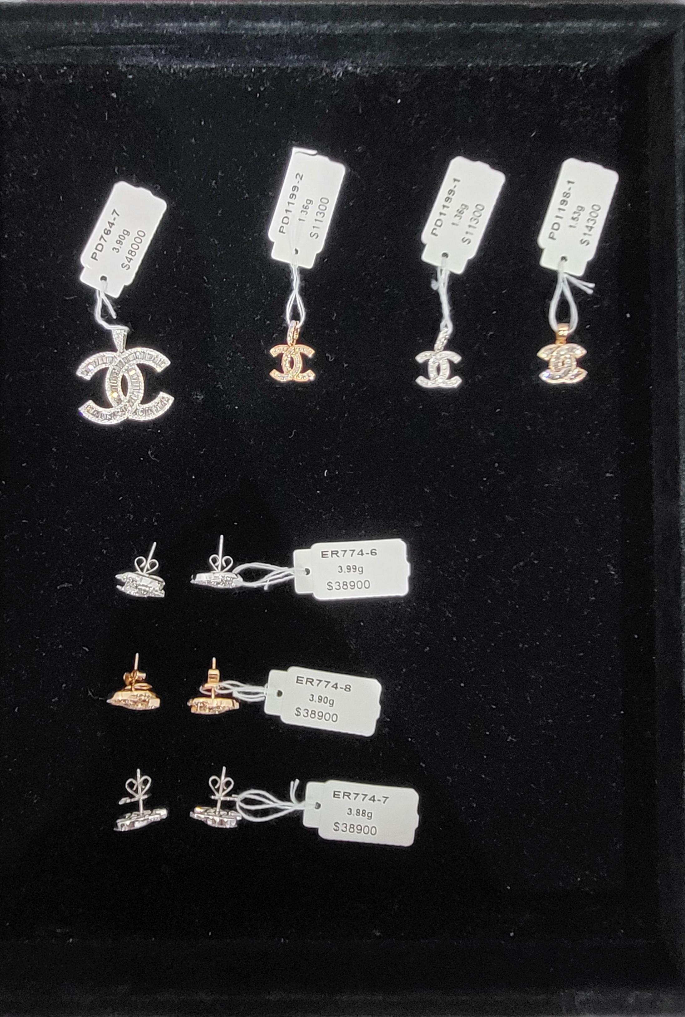 Hong Kong Customs today (June 17) conducted an operation against the sale of counterfeit goods at a fair being held at the Hong Kong Convention and Exhibition Centre and seized about 49 items of suspected counterfeit jewellery with a total estimated market value of about $1.74 million. Photo shows the suspected counterfeit pendants and earrings seized.