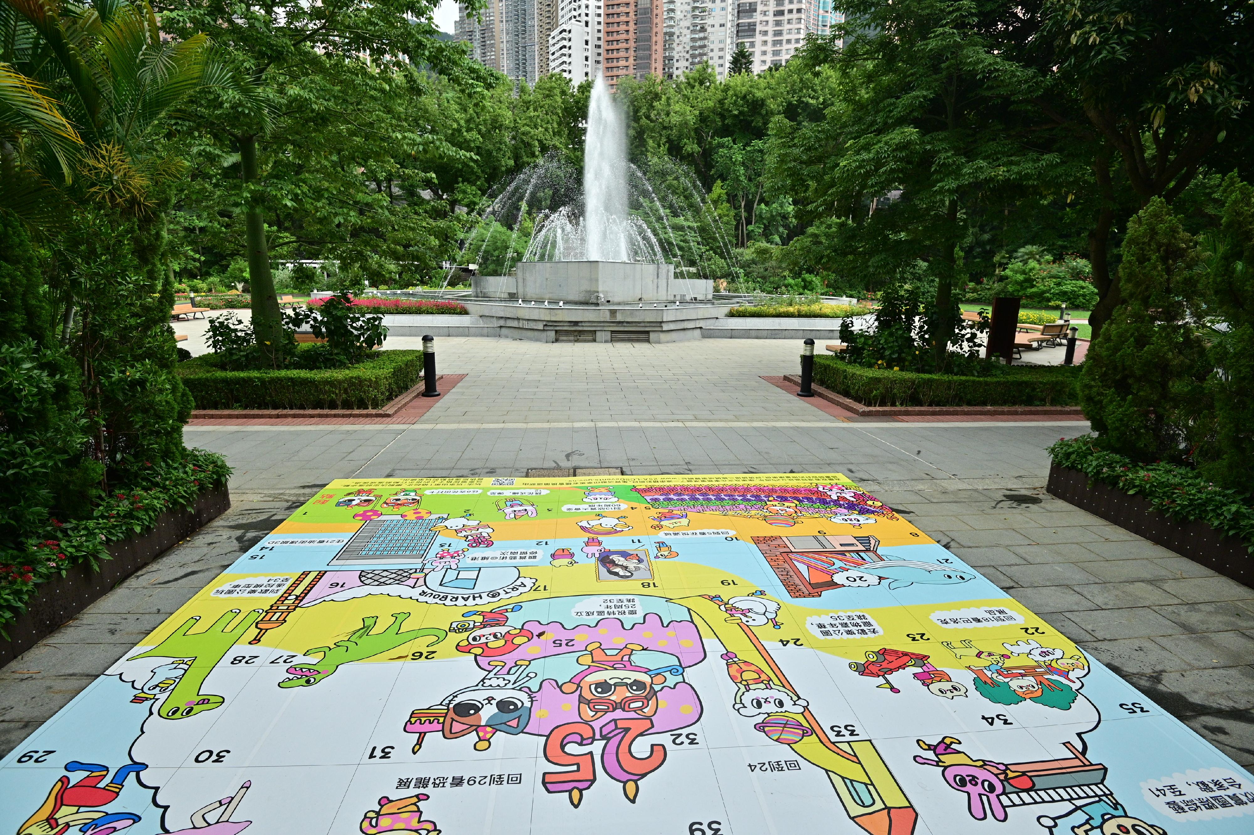 To celebrate the 25th anniversary of the establishment of the Hong Kong Special Administrative Region of the People's Republic of China, the Leisure and Cultural Services Department (LCSD) has invited an illustrator to design a board game with the theme of celebration activities organised by the LCSD, and adapt the board game to floor stickers. The floor stickers will be installed at nine LCSD leisure and cultural venues in phases for members of the public to share the joy of Hong Kong's return to the motherland. Photo shows the board game floor sticker located at the Hong Kong Zoological and Botanical Gardens.