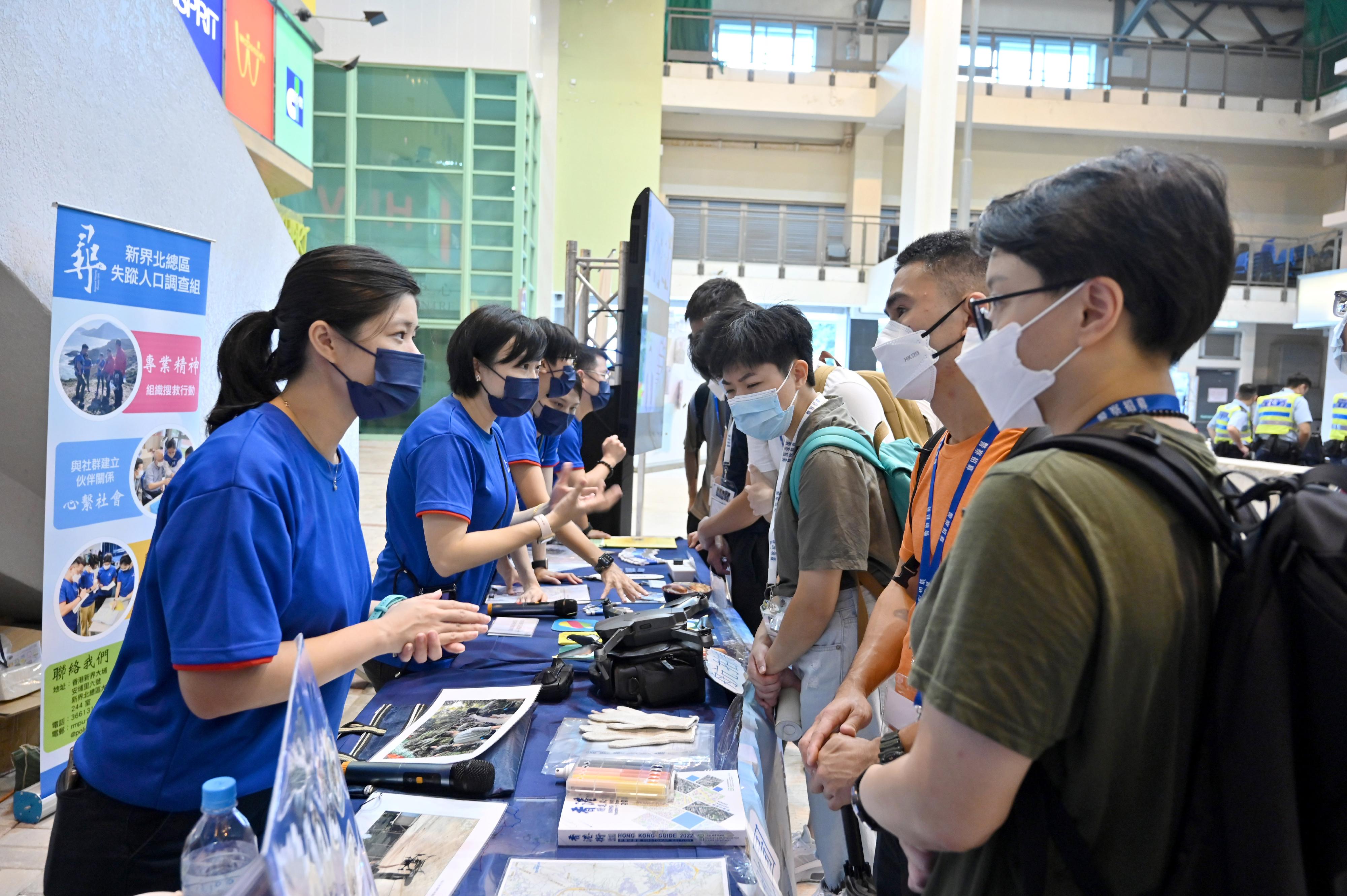 The Hong Kong Police Force today (June 19) organised the Police Recruitment Experience and Assessment Day at the Hong Kong Police College. Photo shows officers from the Missing Person Unit introducing their work to participants.
