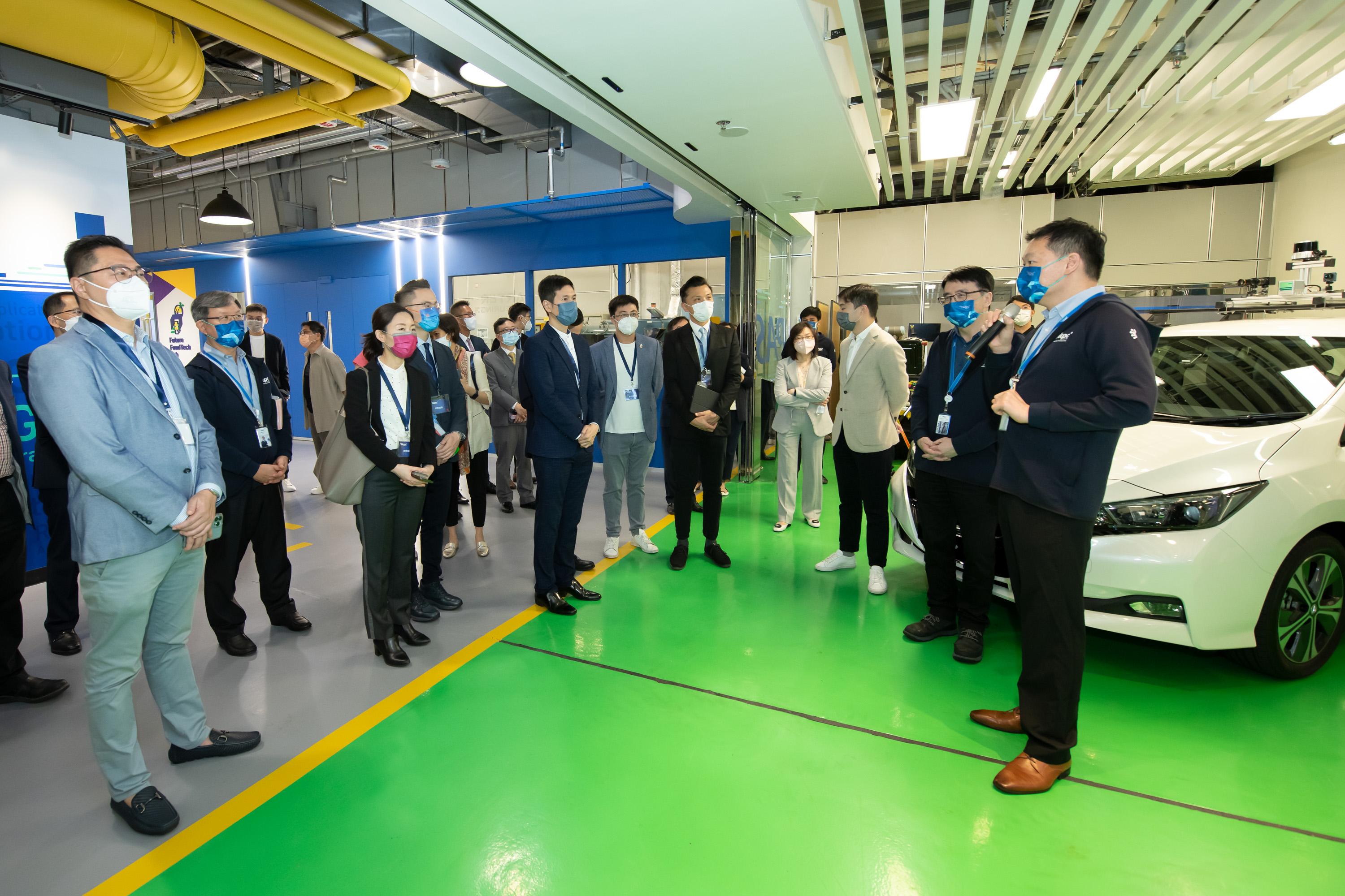 The Legislative Council (LegCo) Panel on Commerce and Industry visited the Hong Kong Productivity Council (HKPC) today (June 20).  Photo shows LegCo Members visiting the Automotive Platforms and Application Systems Research and Development Centre of HKPC. 