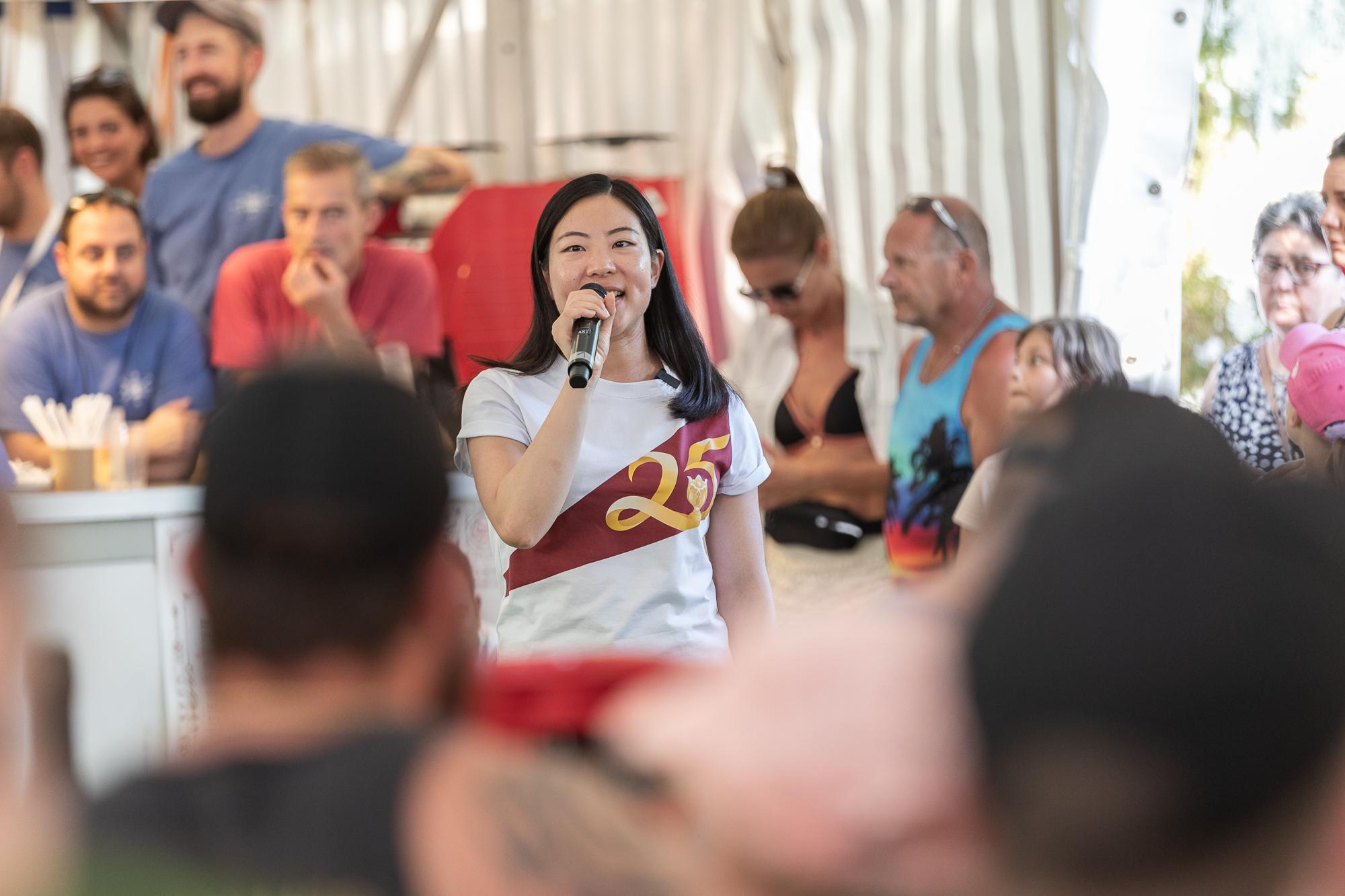 The Deputy Director of  the Hong Kong Economic and Trade Office, Berlin, Ms Bonnie Ka, speaks at the prize presentation ceremony of the dragon boat race in Eglisau, Switzerland, on June 26 (Swiss time).
