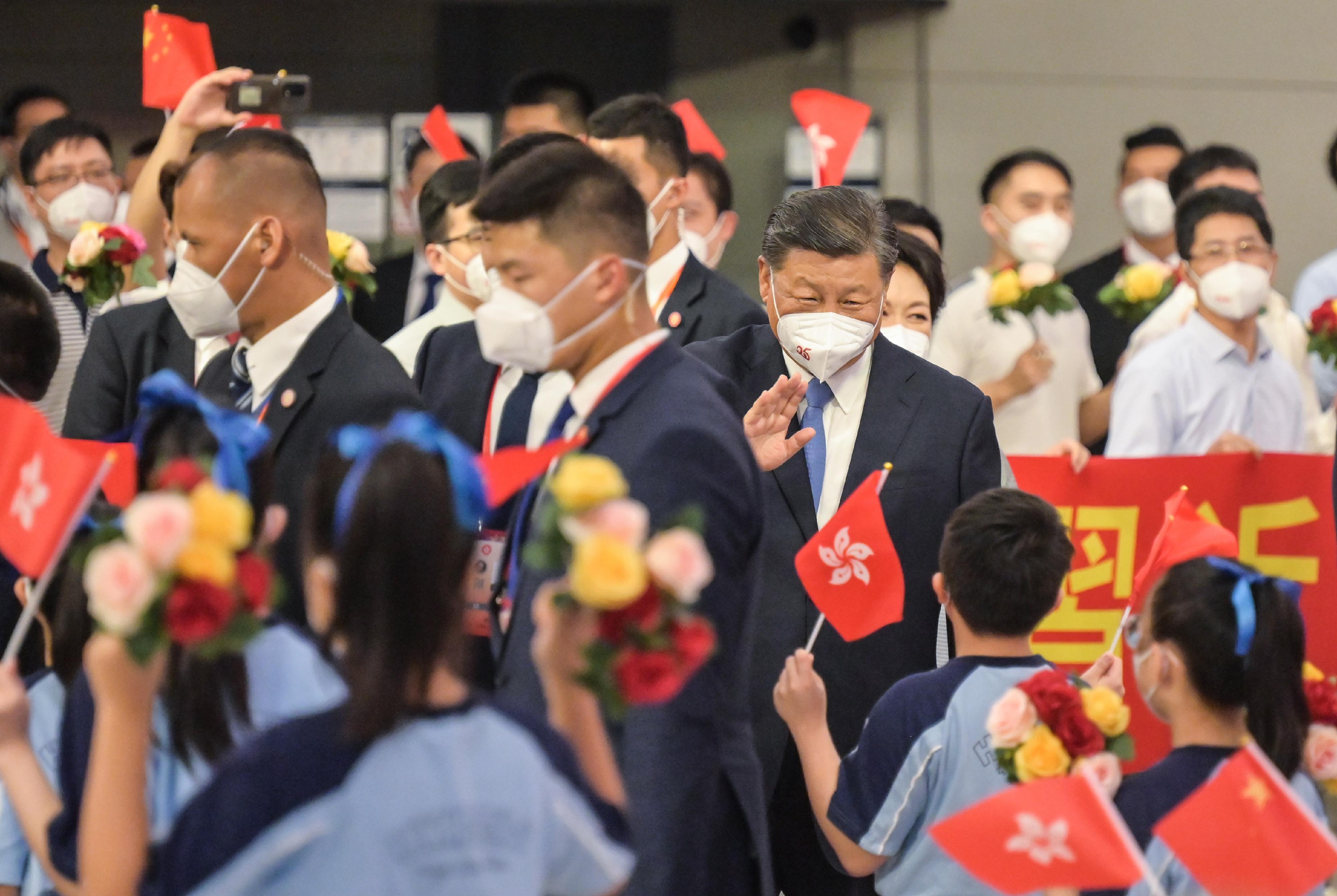 President Xi Jinping waves to the students and people welcoming his arrival at the West Kowloon Station of the Guangzhou-Shenzhen-Hong Kong Express Rail Link today (June 30).