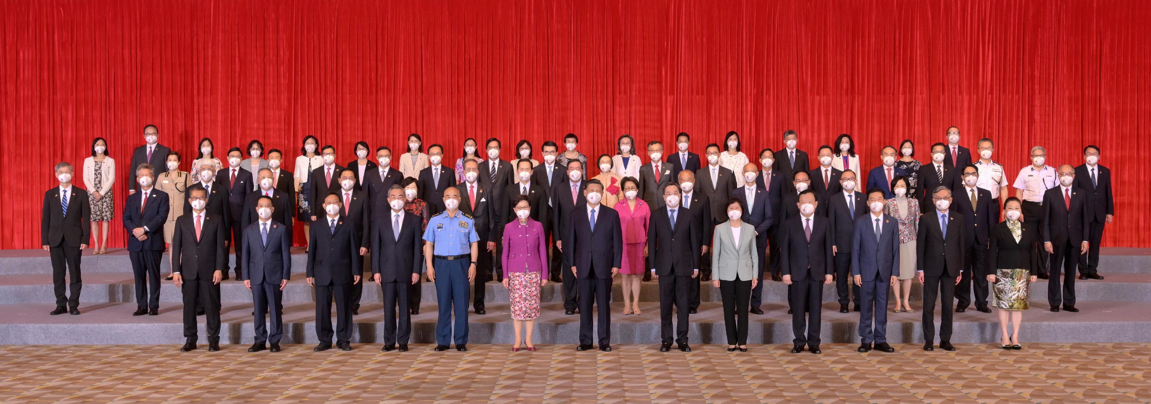 President Xi Jinping (front row, centre) is pictured with the Chief Executive, Mrs Carrie Lam (front row, sixth left), and members of the executive, the legislature and the judiciary, as well as the Principal Officials and Permanent Secretaries of the fifth-term Government of the Hong Kong Special Administrative Region this afternoon (June 30).