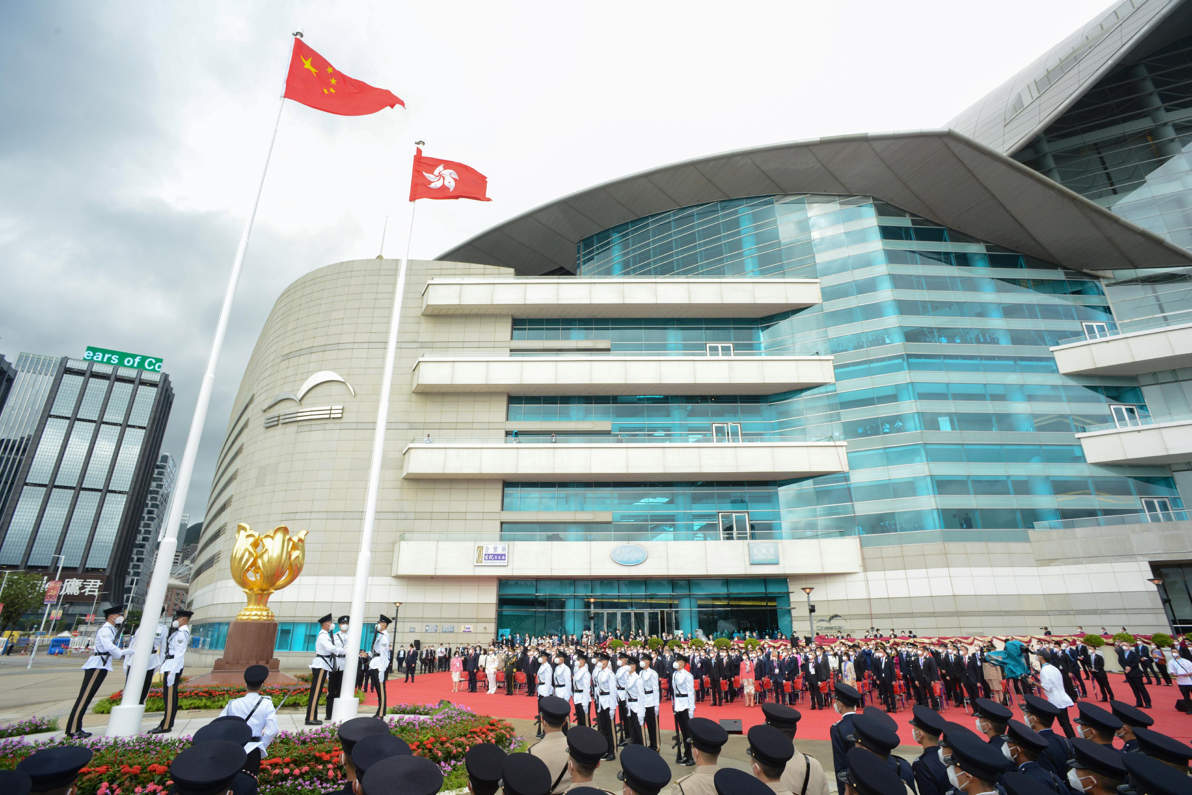 The Chief Executive, Mr John Lee, Principal Officials and guests attend the Flag-raising Ceremony to Celebrate the 25th Anniversary of the Establishment of the Hong Kong Special Administrative Region of the People's Republic of China at Golden Bauhinia Square this morning (July 1).