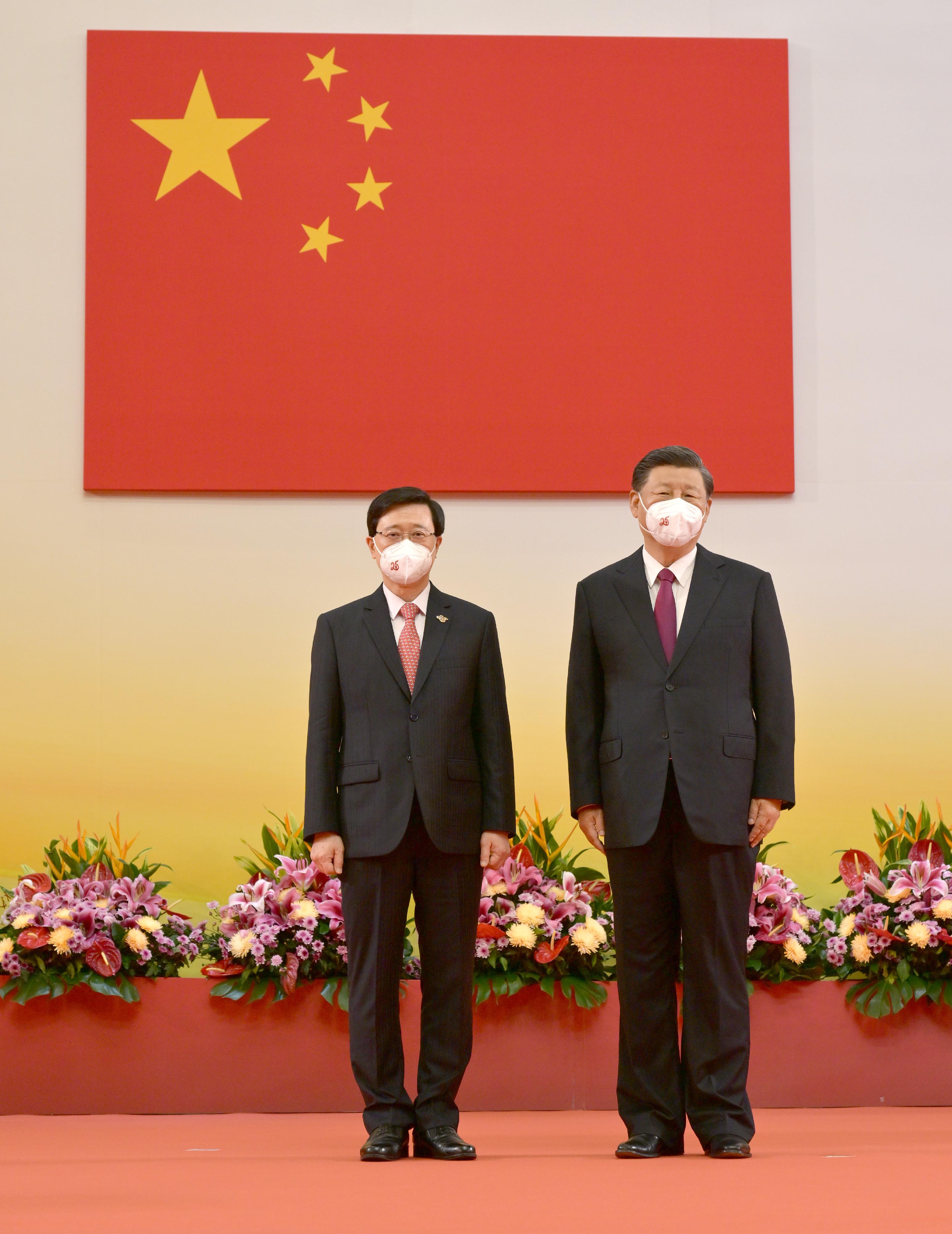 President Xi Jinping swore in the Chief Executive, Mr John Lee, at the Inaugural Ceremony of the Sixth-term Government of the Hong Kong Special Administrative Region at the Hong Kong Convention and Exhibition Centre this morning (July 1). The President (right) and Mr Lee (left) are pictured after the swearing-in.