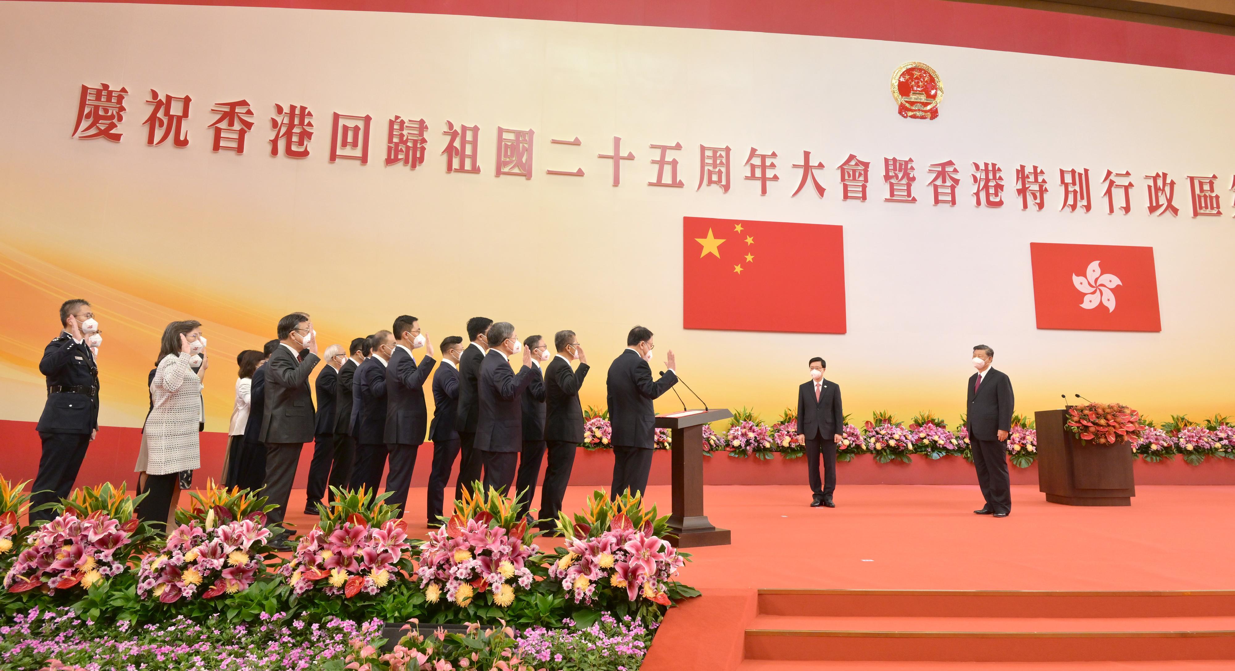 President Xi Jinping (first right) swears in Principal Officials of the sixth-term Hong Kong Special Administrative Region Government at the Inaugural Ceremony of the Sixth-term Government of the Hong Kong Special Administrative Region at the Hong Kong Convention and Exhibition Centre this morning (July 1). Looking on is the Chief Executive, Mr John Lee (second right).