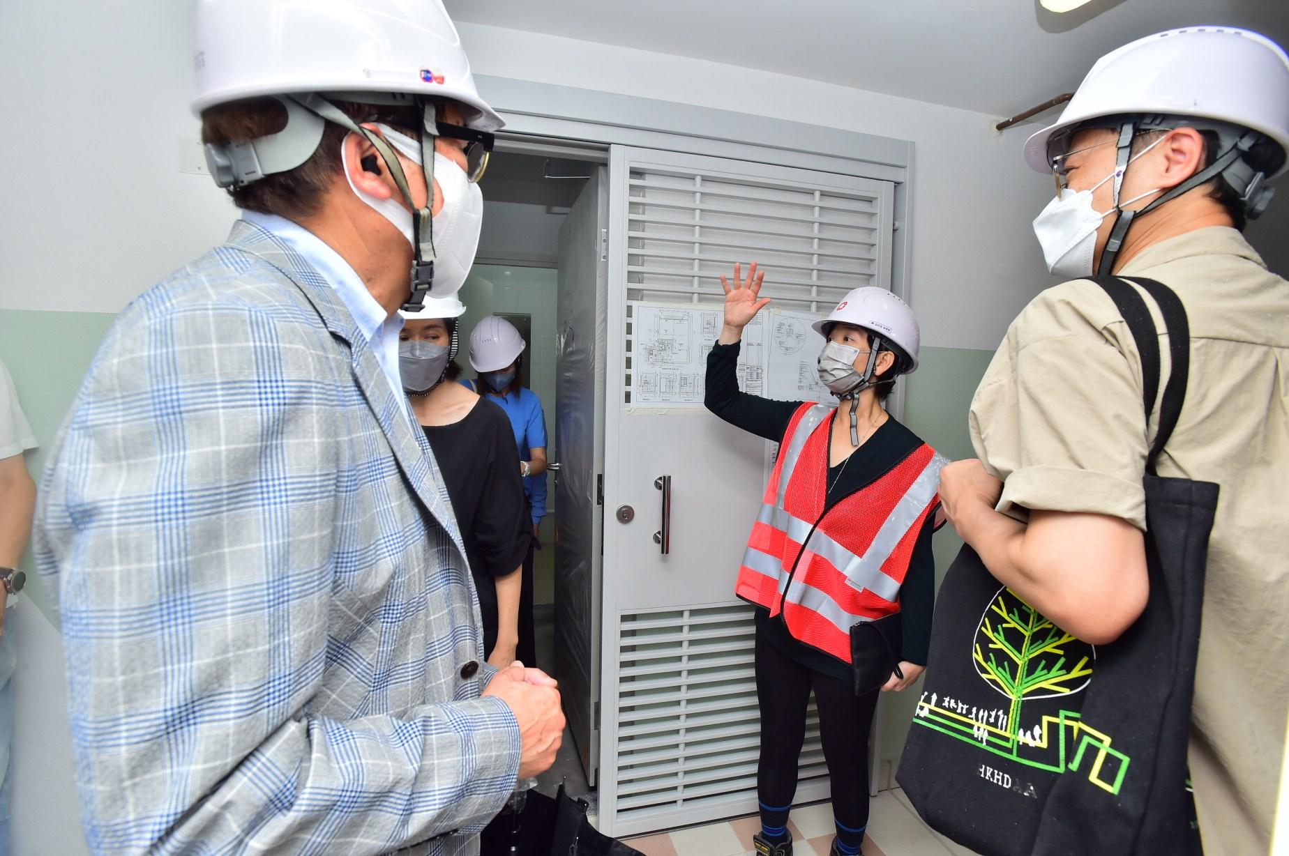 The Secretary for Housing, Ms Winnie Ho, visited Tai Po Area 9 this morning (July 7) to grasp the latest progress of the public rental housing development projects. Photo shows Ms Ho (second right) being briefed about the project details and progress by staff members of the Housing Department when touring Fu Tip Estate, which is under construction.