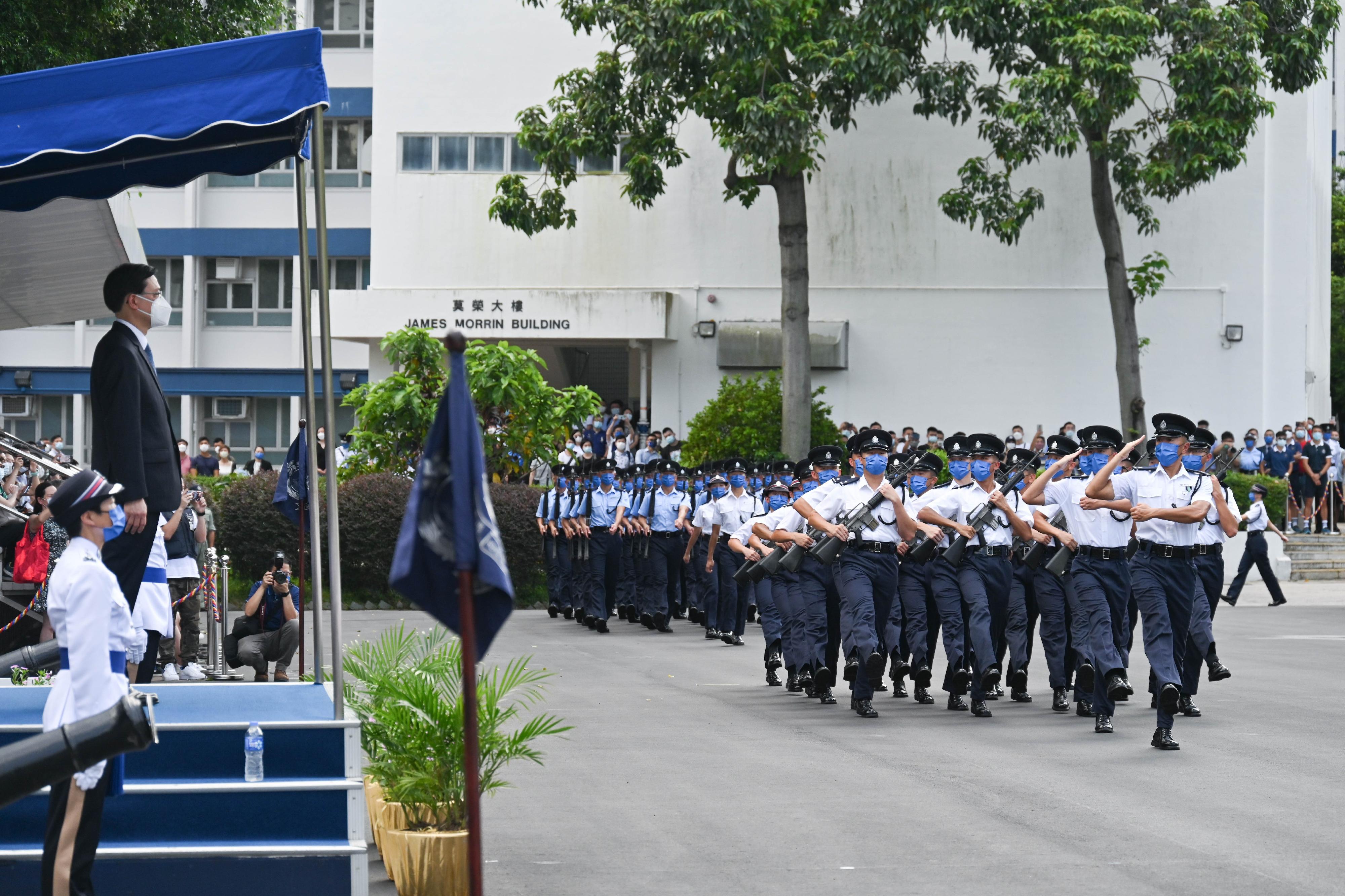 The Chief Executive, Mr John Lee, inspects the passing-out parade held at the Hong Kong Police College today (July 9).