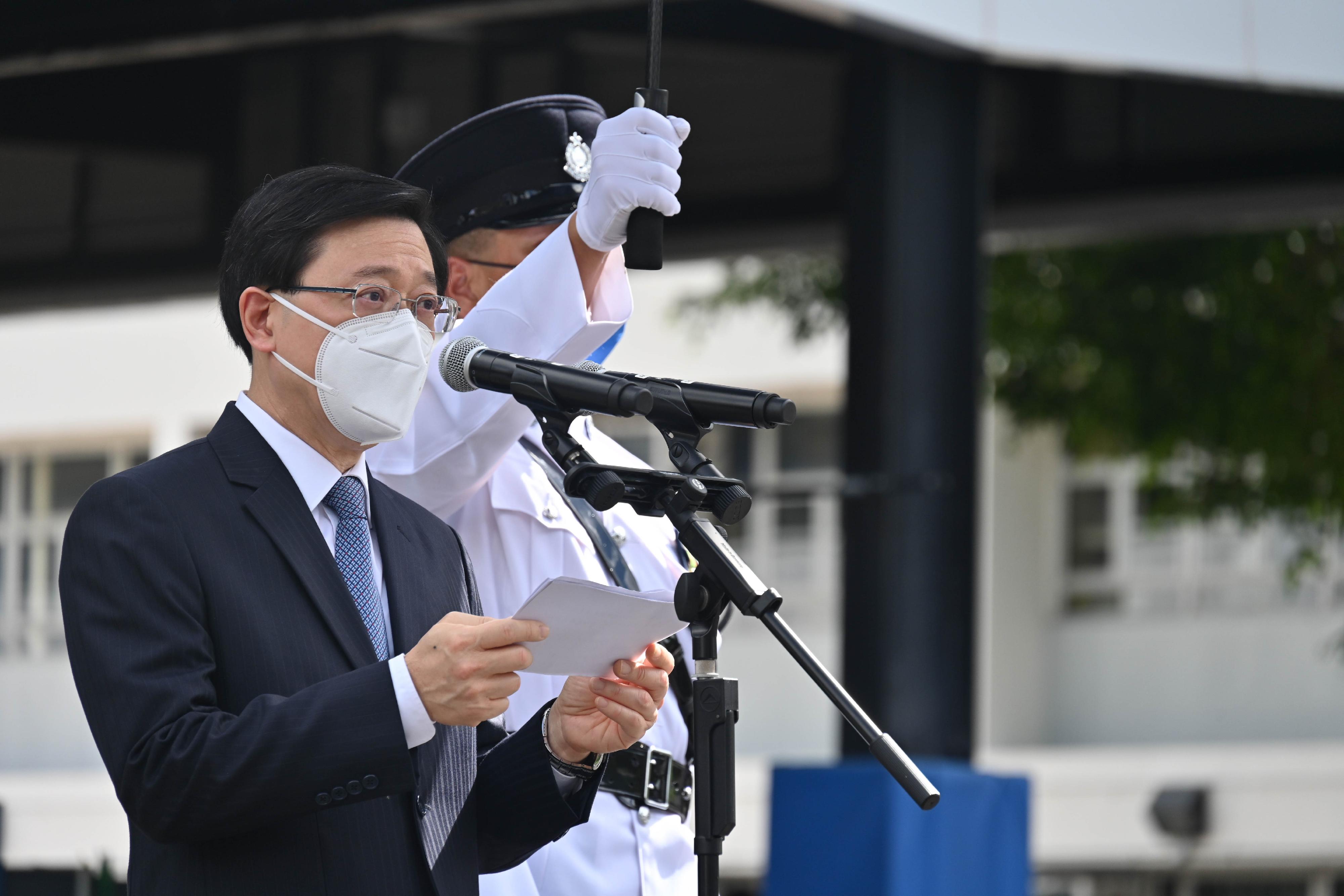 The Chief Executive, Mr John Lee, speaks at the passing-out parade held at the Hong Kong Police College today (July 9).