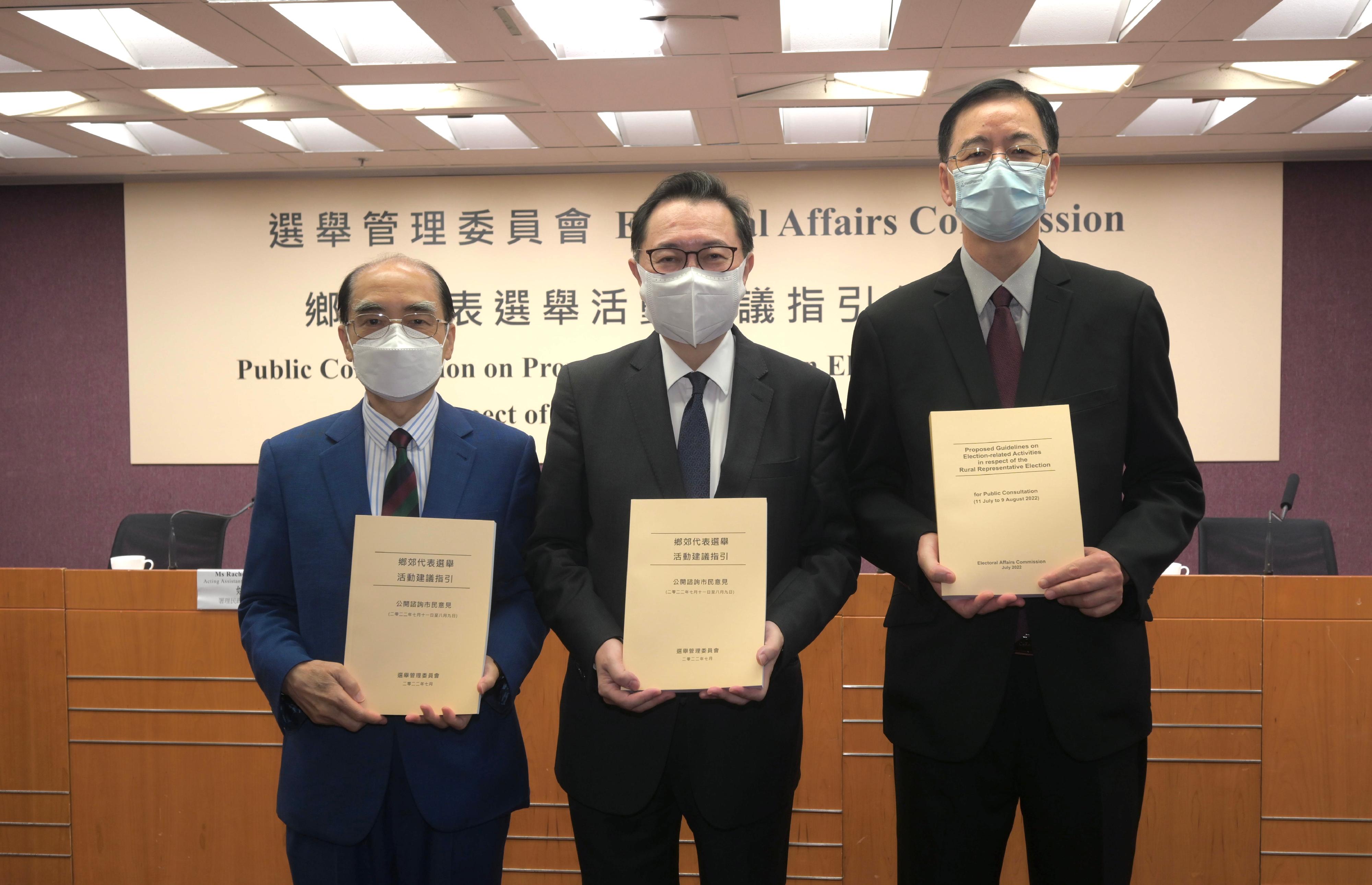 The Chairman of the Electoral Affairs Commission (EAC), Mr Justice Barnabas Fung Wah (centre), and EAC members Mr Arthur Luk, SC (left), and Professor Daniel Shek (right) present the Proposed Guidelines on Election-related Activities in respect of the Rural Representative Election at a press conference today (July 11).