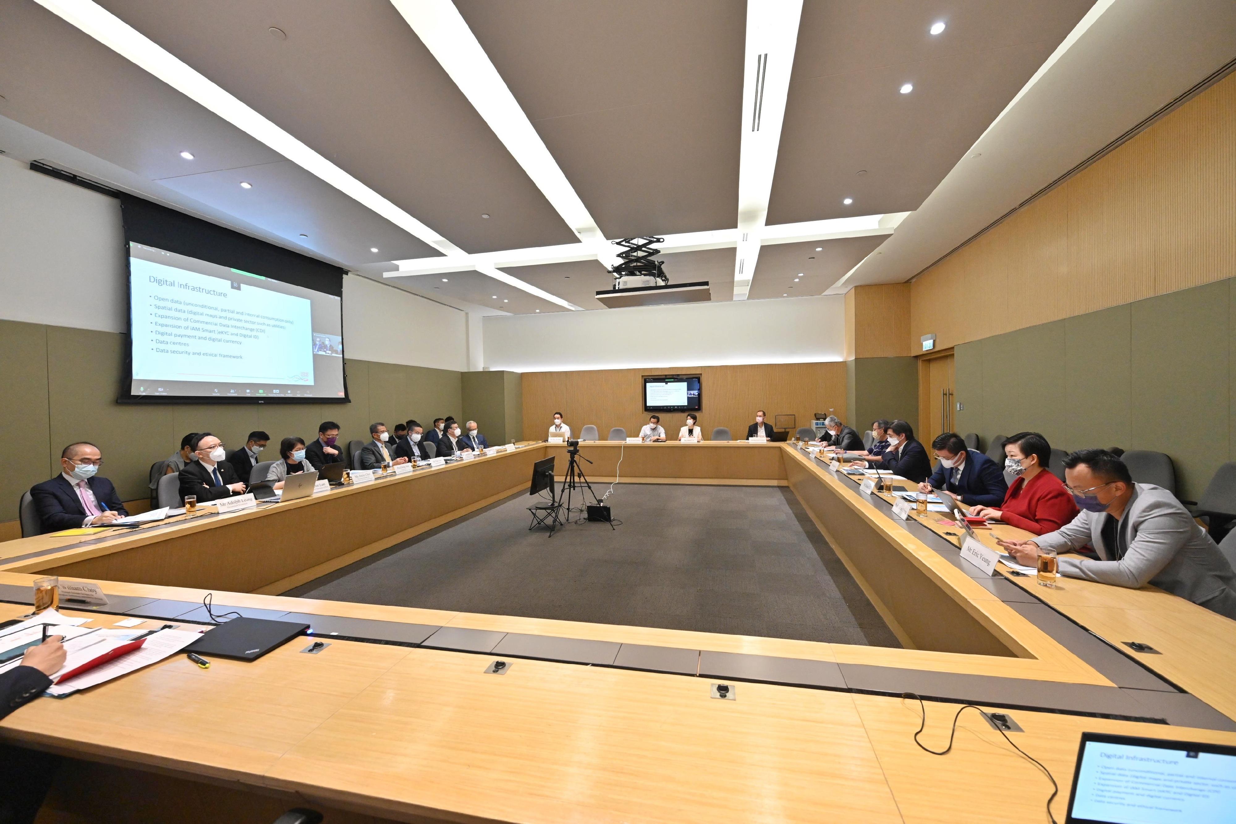 The Financial Secretary, Mr Paul Chan (fifth left), chairs the first meeting of the Digital Economy Development Committee today (July 11). 