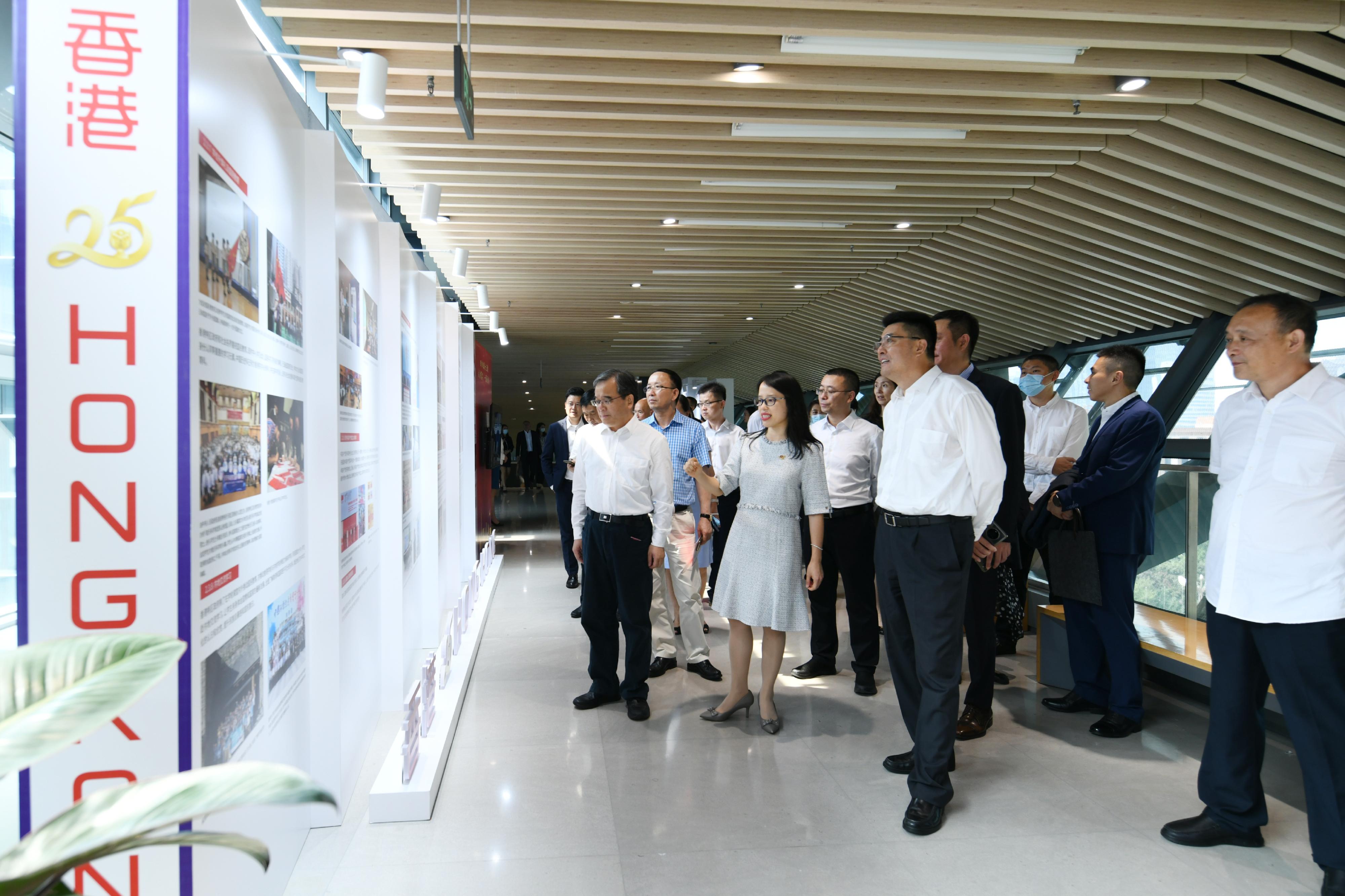The Hong Kong Economic and Trade Office in Chengdu (CDETO) of the Government of the Hong Kong Special Administrative Region (HKSAR) has been holding a series of celebration activities since June to mark the 25th anniversary of the establishment of the HKSAR. Photo shows the Director of the CDETO, Miss Li Wan-in (front row, second left), touring the CDETO's roving exhibition on the 25th anniversary of Hong Kong's return to the motherland with other guests in Chengdu today (July 11). 