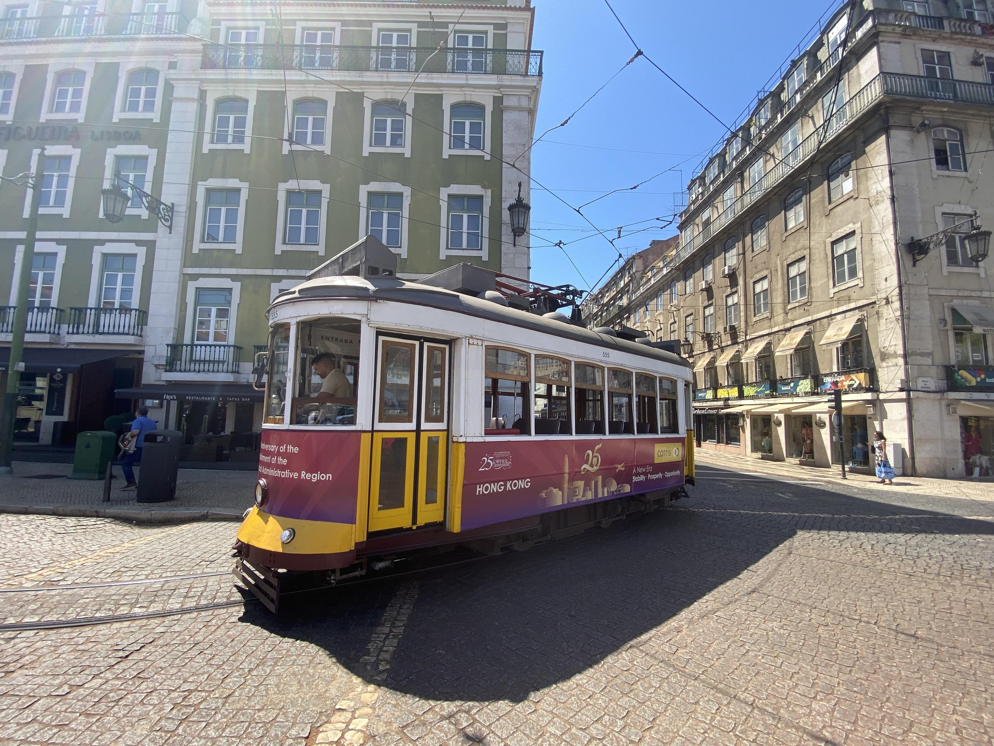 At the initiative of the Hong Kong Economic and Trade Office in Brussels, one of the trams decorated in the festive colours of the 25th anniversary of the establishment of the Hong Kong Special Administrative Region operates on the streets of Lisbon, Portugal, between June and August 2022.