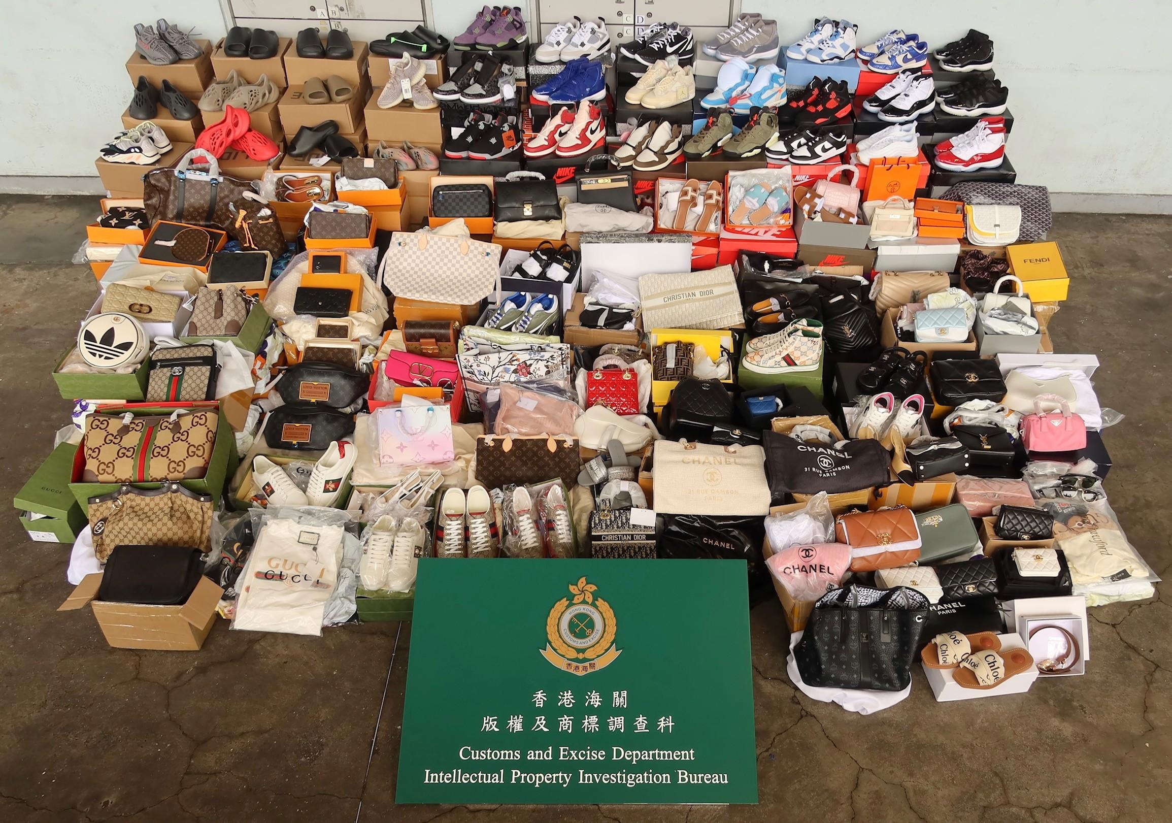 Hong Kong Customs seized about 2 800 items of suspected counterfeit goods with a total estimated market value of about $4.1 million at Man Kam To Control Point, Yuen Long and Kwai Chung from July 5 to 8. Photo shows some of the suspected counterfeit goods seized by Customs officers at Man Kam To Control Point.