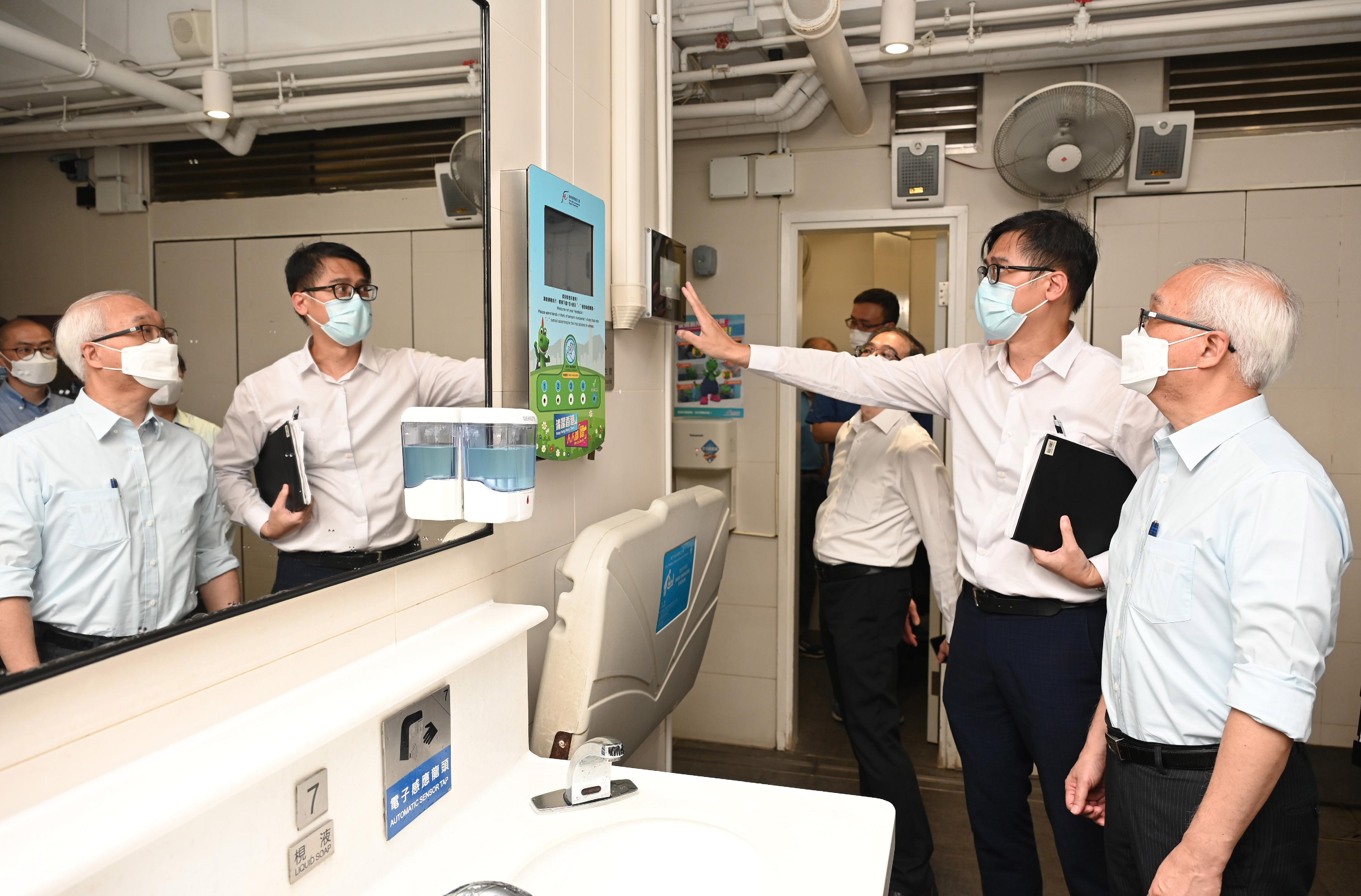 The Secretary for Environment and Ecology, Mr Tse Chin-wan, today (July 18) visited the Food and Environmental Hygiene Department (FEHD) headquarters and Wan Chai District Environmental Hygiene Office to inspect facilities managed by the FEHD and learn more about the work of the colleagues. Picture shows Mr Tse (right) visiting the refurbished public toilet at Southorn Centre, where he was briefed on the refurbishment plan for public toilets, the application of smart public toilets and feedback from the public.