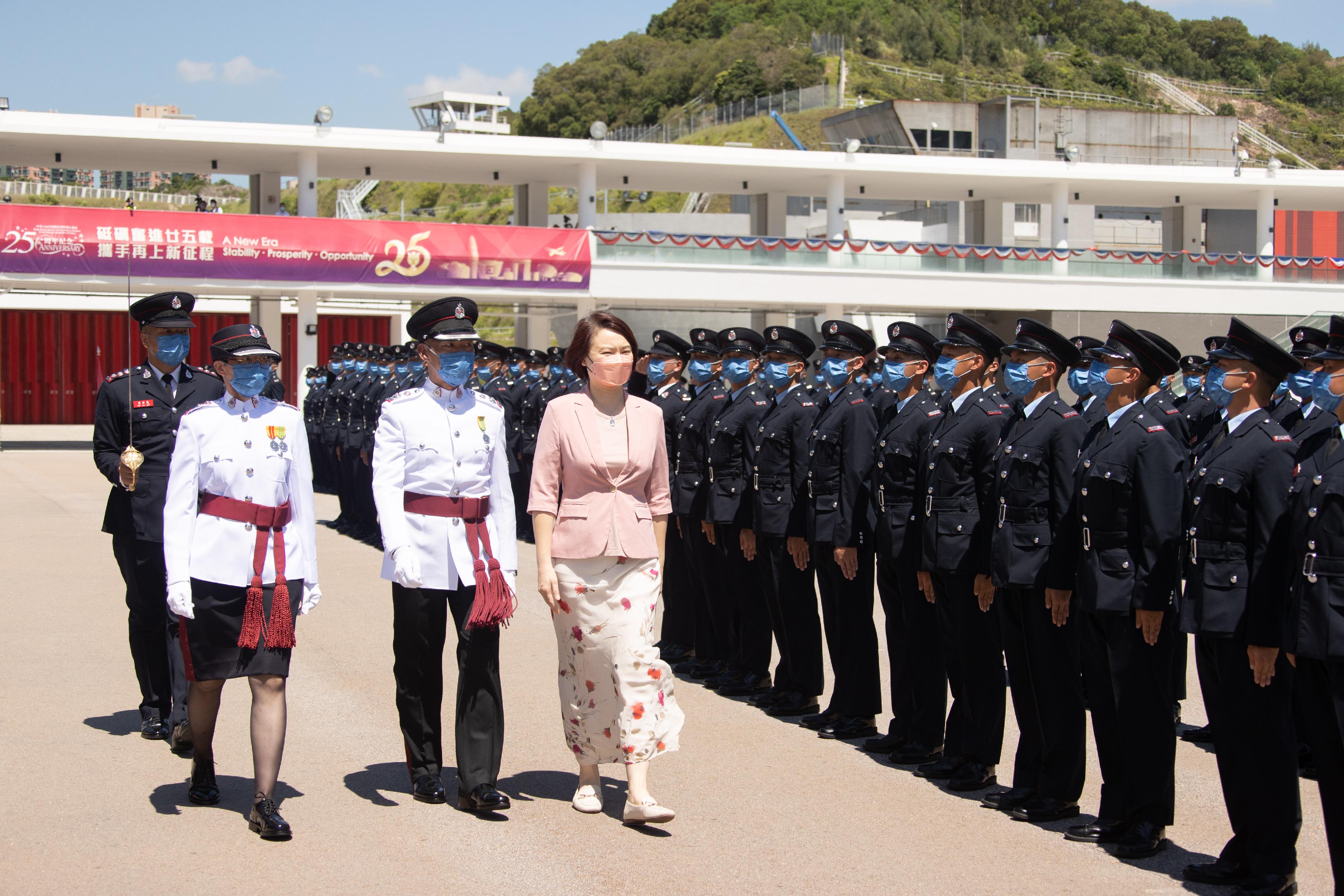 Member of the Legislative Council, Ms Starry Lee, reviews the Fire Services passing-out parade at the Fire and Ambulance Services Academy today (July 22).