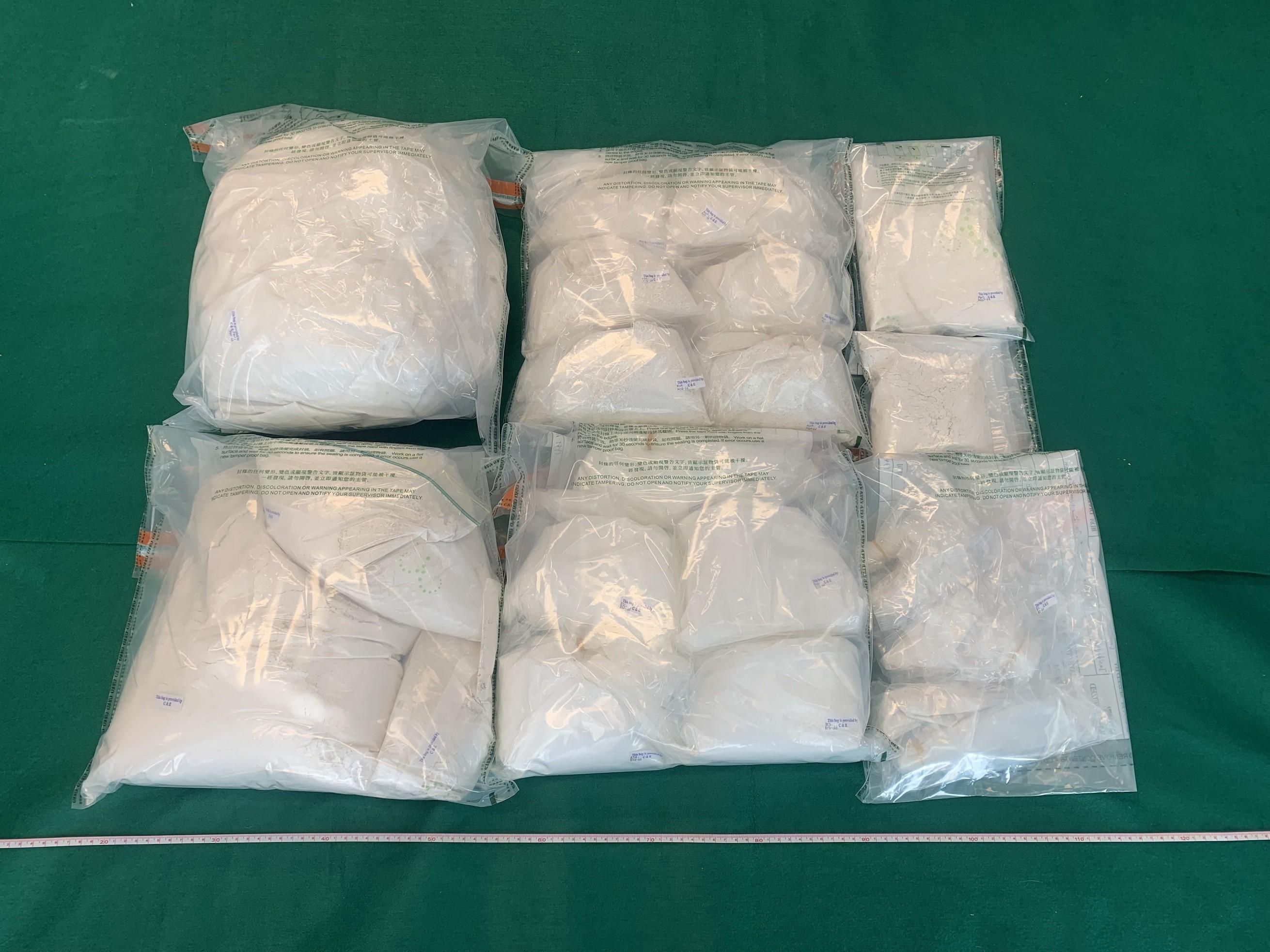 Hong Kong Customs seized about 20 kilograms of suspected heroin and about 2.4kg of suspected cocaine in To Kwa Wan and at Hong Kong International Airport in the past two days (July 21 and 22). The estimated market value was about $18.8 million and about $2.2 million respectively. Photo shows the suspected heroin seized.