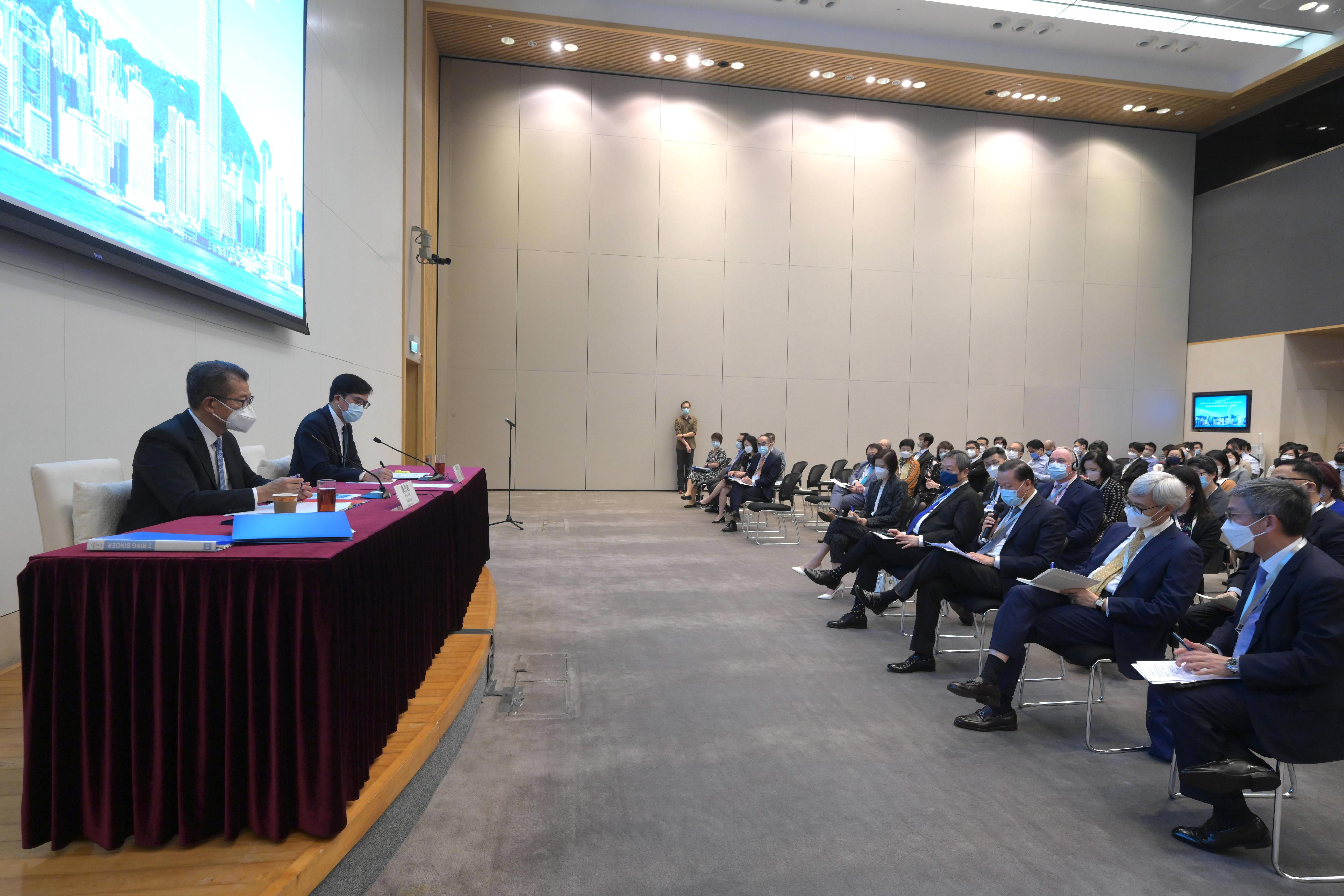 The Financial Secretary, Mr Paul Chan, today (August 3) hosted a session on "Spirit of the President's Important Speech" at the Central Government Offices, with more than 100 senior officers and representatives of financial regulators as well as colleagues of the Financial Secretary's Office in attendance. Photo shows Mr Chan (first left) speaking at the session. Also present is the Deputy Financial Secretary, Mr Michael Wong (second left).