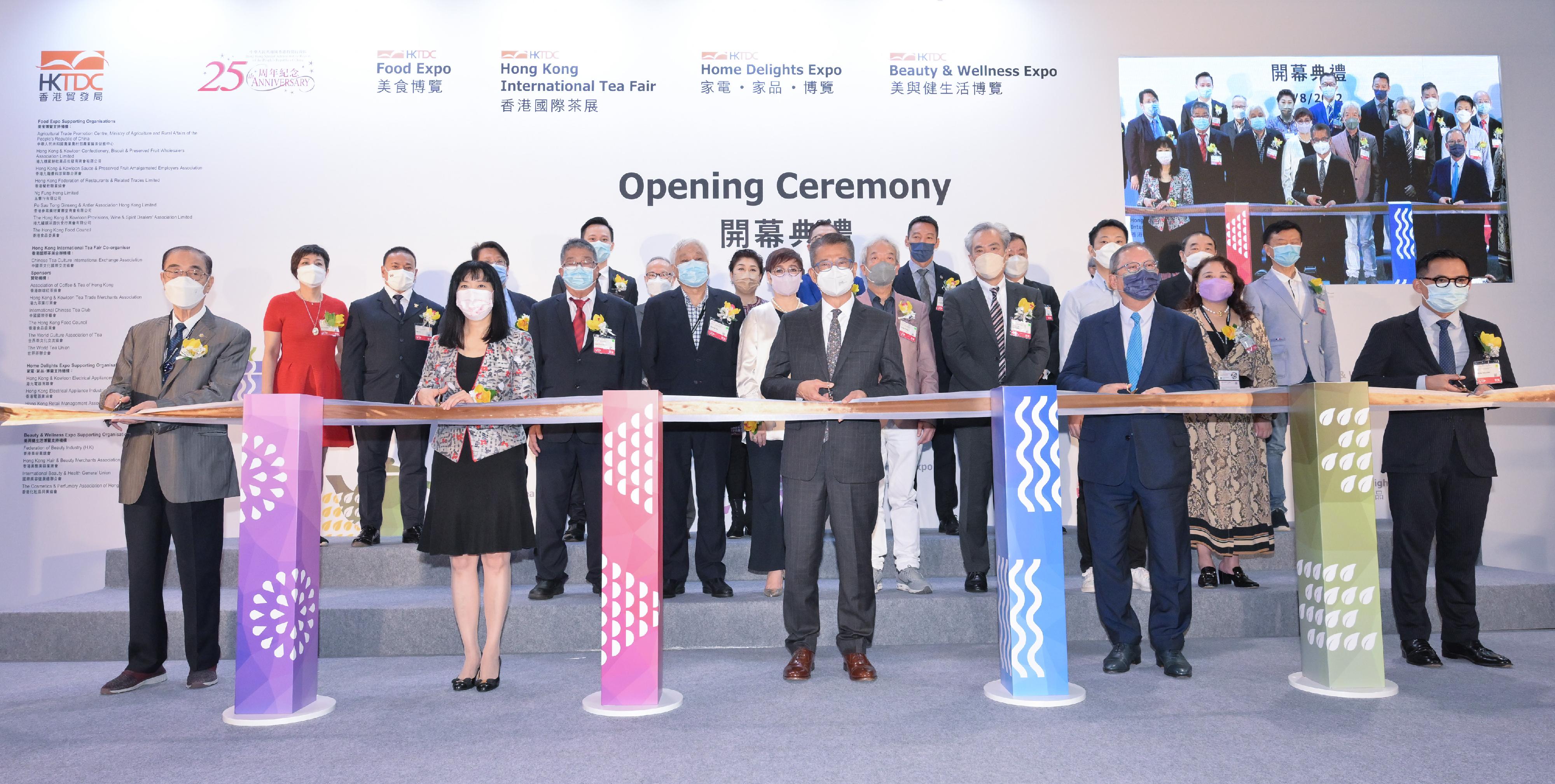 The Financial Secretary, Mr Paul Chan, attended the Joint Opening Ceremony of the Hong Kong Trade Development Council (HKTDC) Food Expo, Hong Kong International Tea Fair, Home Delights Expo and Beauty & Wellness Expo today (August 11). Photo shows Mr Chan (front row, centre); the Chairman of the HKTDC, Dr Peter Lam (front row, second right); the Executive Director of the HKTDC, Ms Margaret Fong (front row, second left); and other guests officiating at the ceremony.