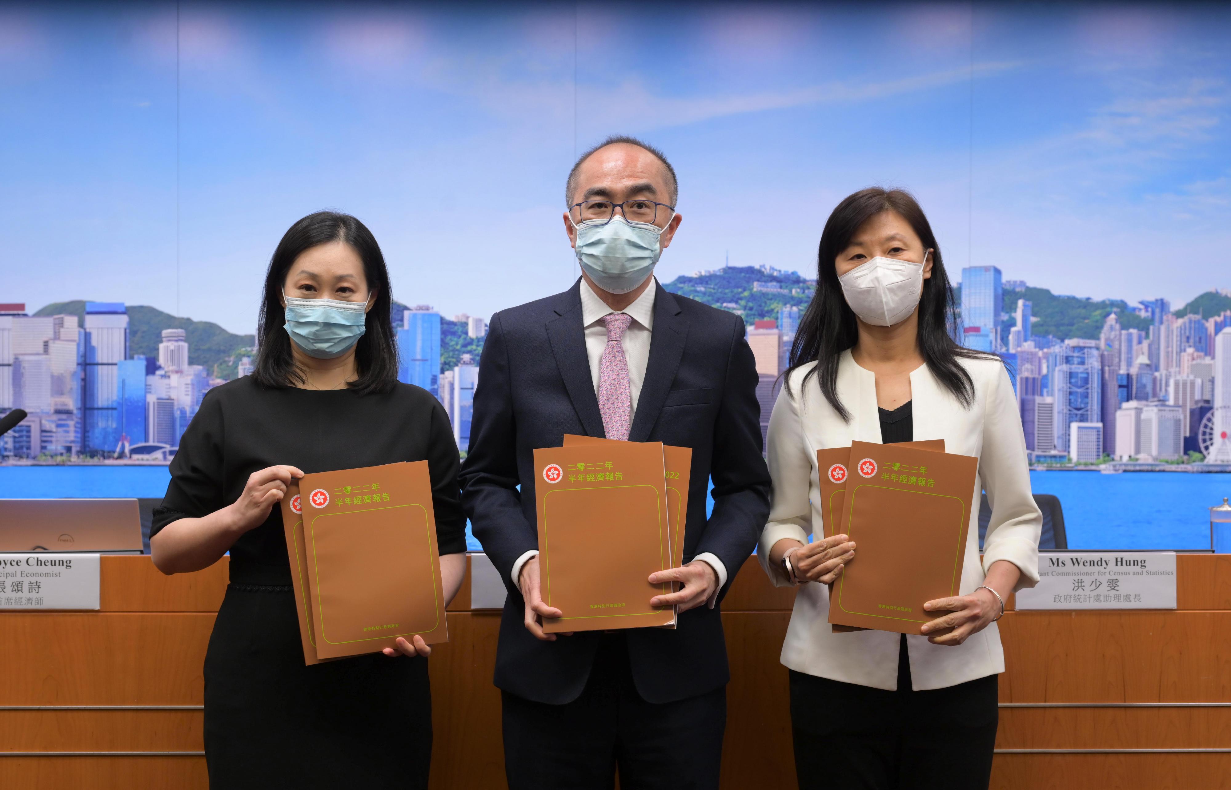 The Government Economist, Mr Adolph Leung (centre), presents the Half-yearly Economic Report 2022 at a press conference today (August 12). Also present are Principal Economist Ms Joyce Cheung (left) and Assistant Commissioner for Census and Statistics Ms Wendy Hung (right).