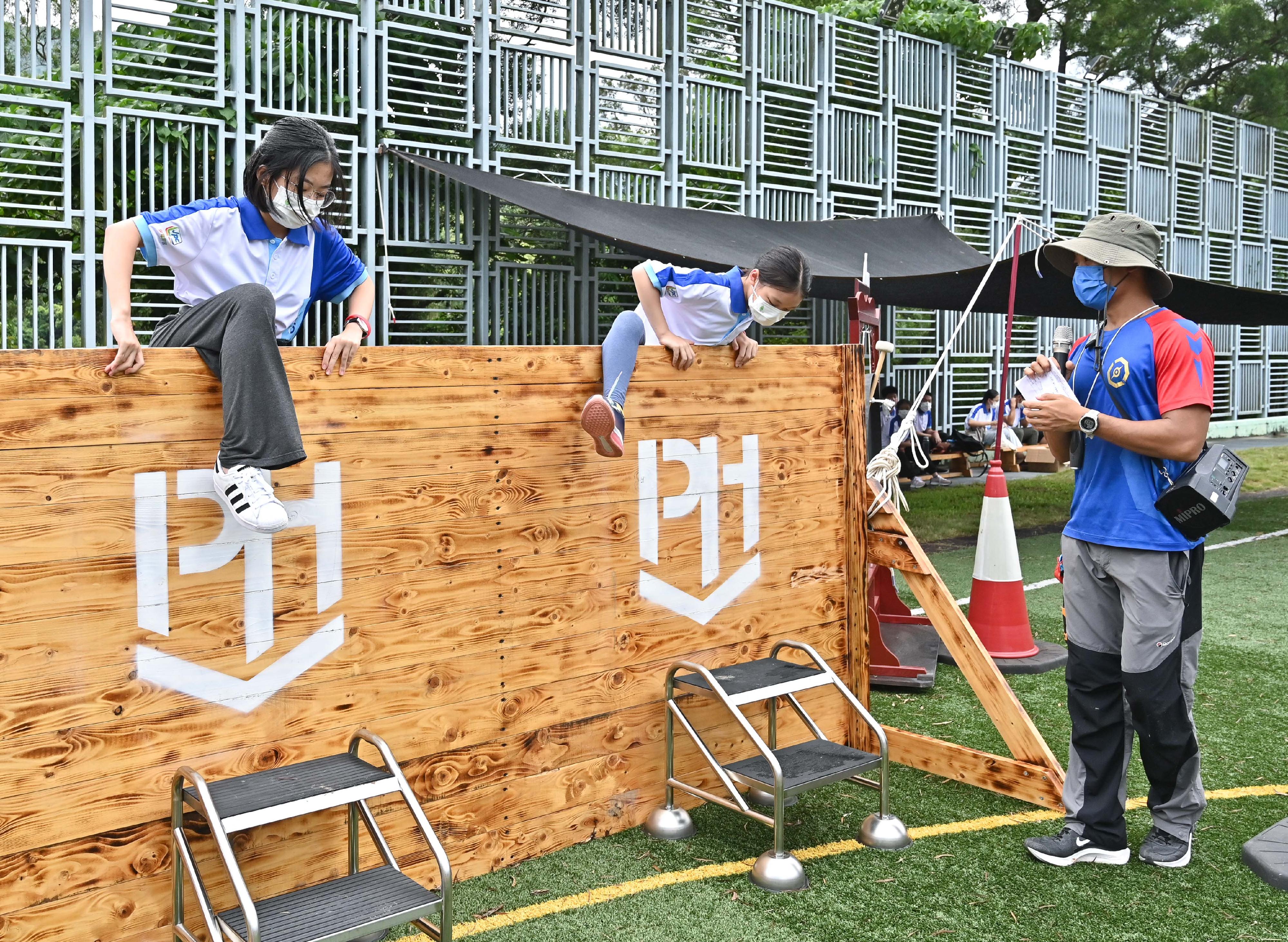 The Opening Ceremony of Junior Police Call Summer Camp 2022 was held today (August 16). Photo shows participants taking part in the Pat Heung Race.