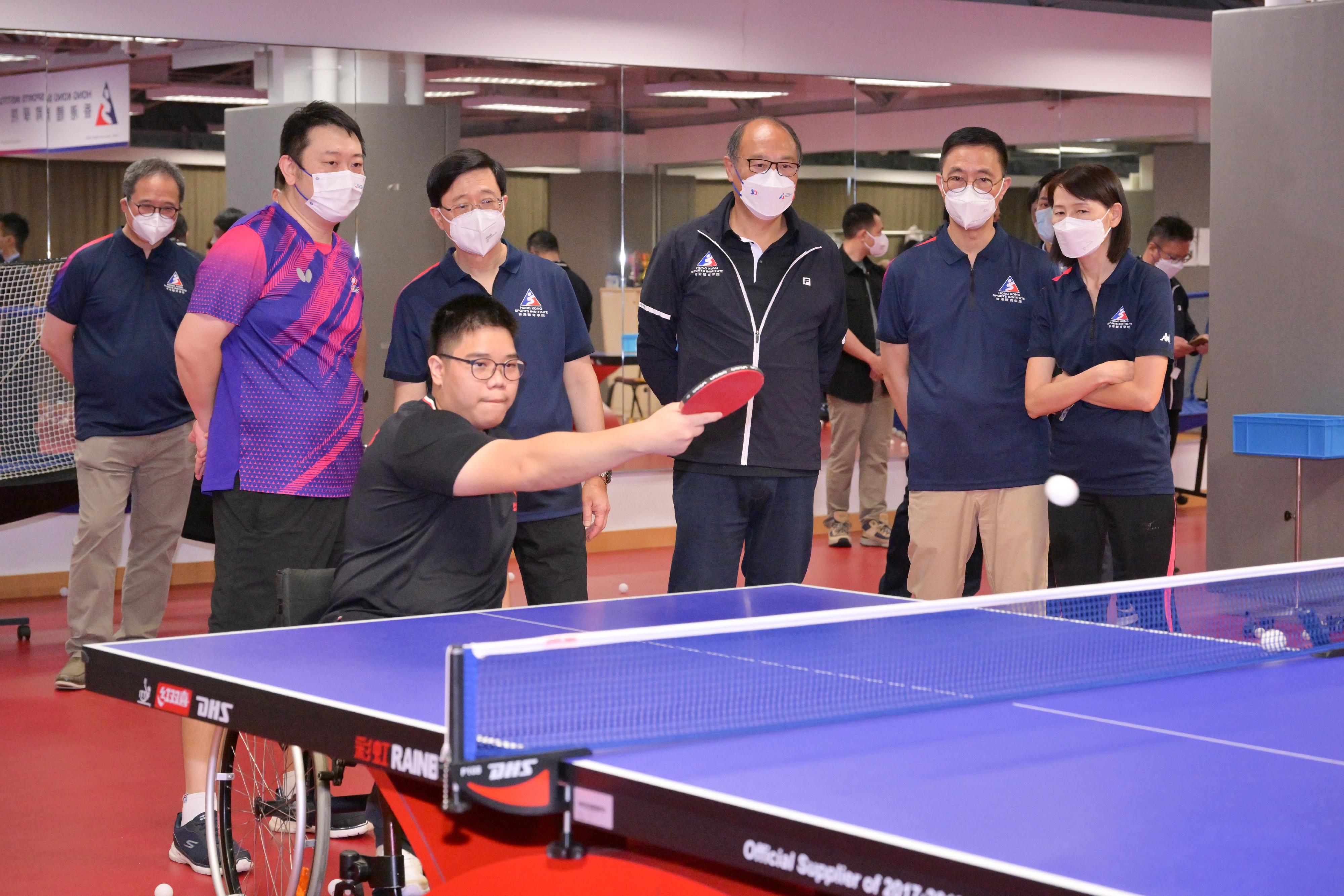 The Chief Executive, Mr John Lee, today (August 16) visited the Hong Kong Sports Institute (HKSI). Photo shows Mr Lee (third left) watching a training session of para table tennis athletes. Looking on are the Secretary for Culture, Sports and Tourism, Mr Kevin Yeung (second right); the Director of the Chief Executive's Office, Ms Carol Yip (first right); and the Chairman of the Board of Directors of the HKSI, Dr Lam Tai-fai (third right).