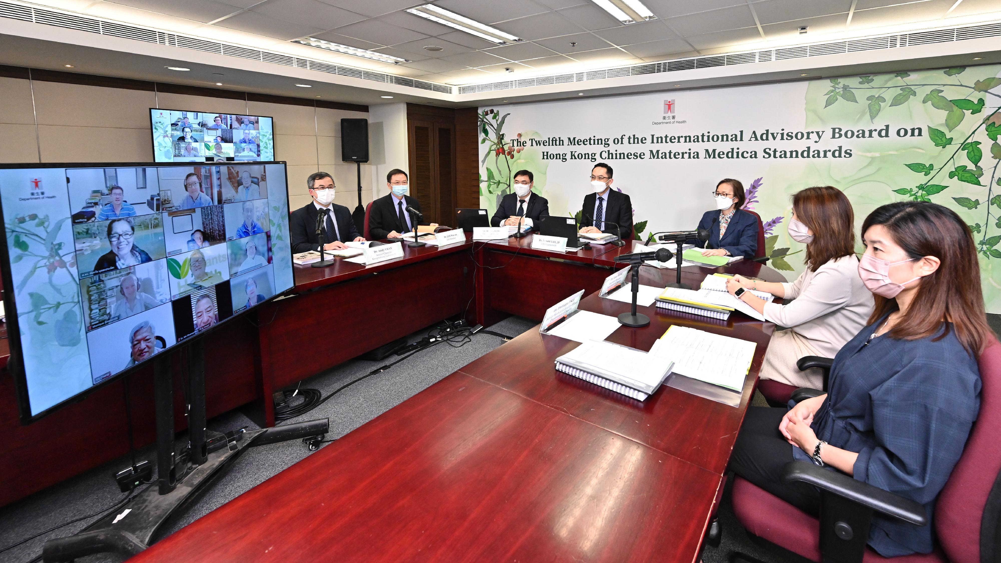 The Department of Health (DH) yesterday (August 16) hosted the 12th meeting of the International Advisory Board on Hong Kong Chinese Materia Medica Standards via video conference to finalise the setting of reference standards for Chinese Materia Medica commonly used in Hong Kong. Photo shows the Director of Health, Dr Ronald Lam (centre); the Controller of Regulatory Affairs of the DH, Dr Amy Chiu (third right); the Government Chemist, Dr Lee Wai-on (second left); the Assistant Director of Health (Chinese Medicine), Dr Alice Wong (second right), and other participants joining the meeting.